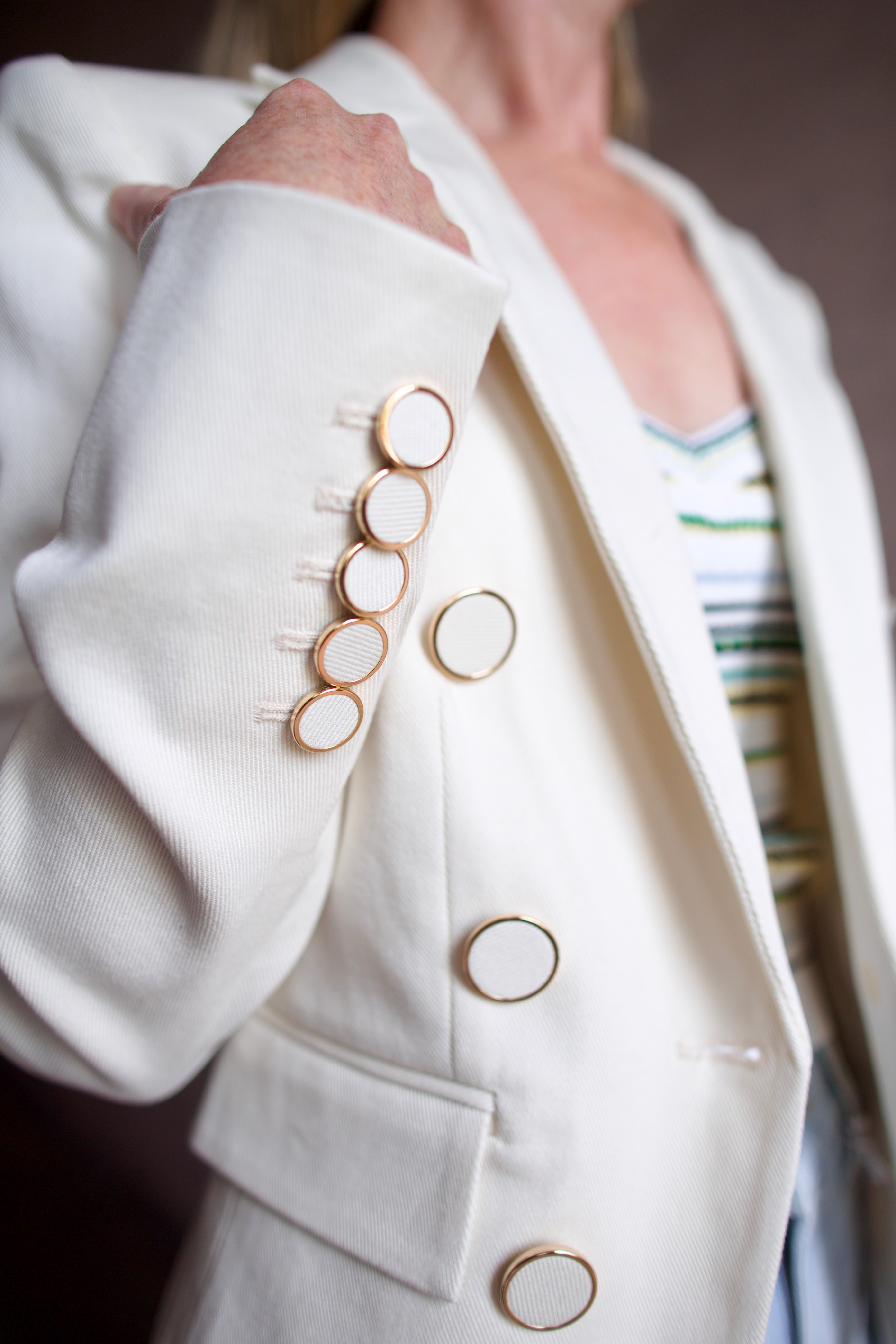 Model wearing the Veronica Beard Diego Jacket fabricated in premium cotton twill and subtle gold trimmed buttons for a refined tailored style
