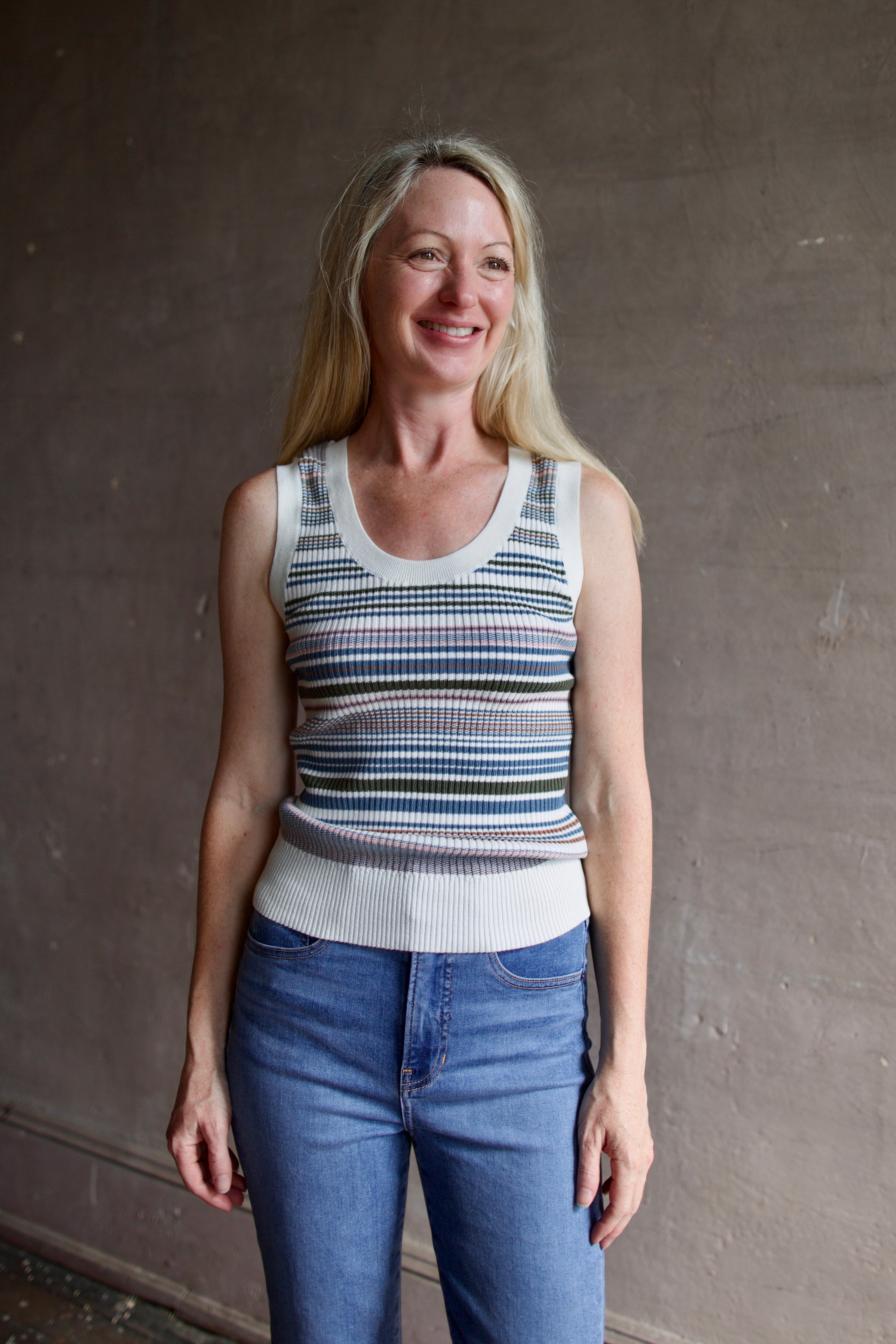 Model wearing the Veronica Beard Ezinna cotton Knit Tank top in casual dove colorway with flattering scoop neckline