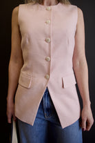 Image of a woman wearing Veronica Beard Lois Vest with button front closure in refined contemporary tailored design perfect for layering