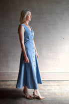 Model wearing Veronica Beard Lou Dress in blue mirage with classic tailored design to accent an amazing feminine silhouette
