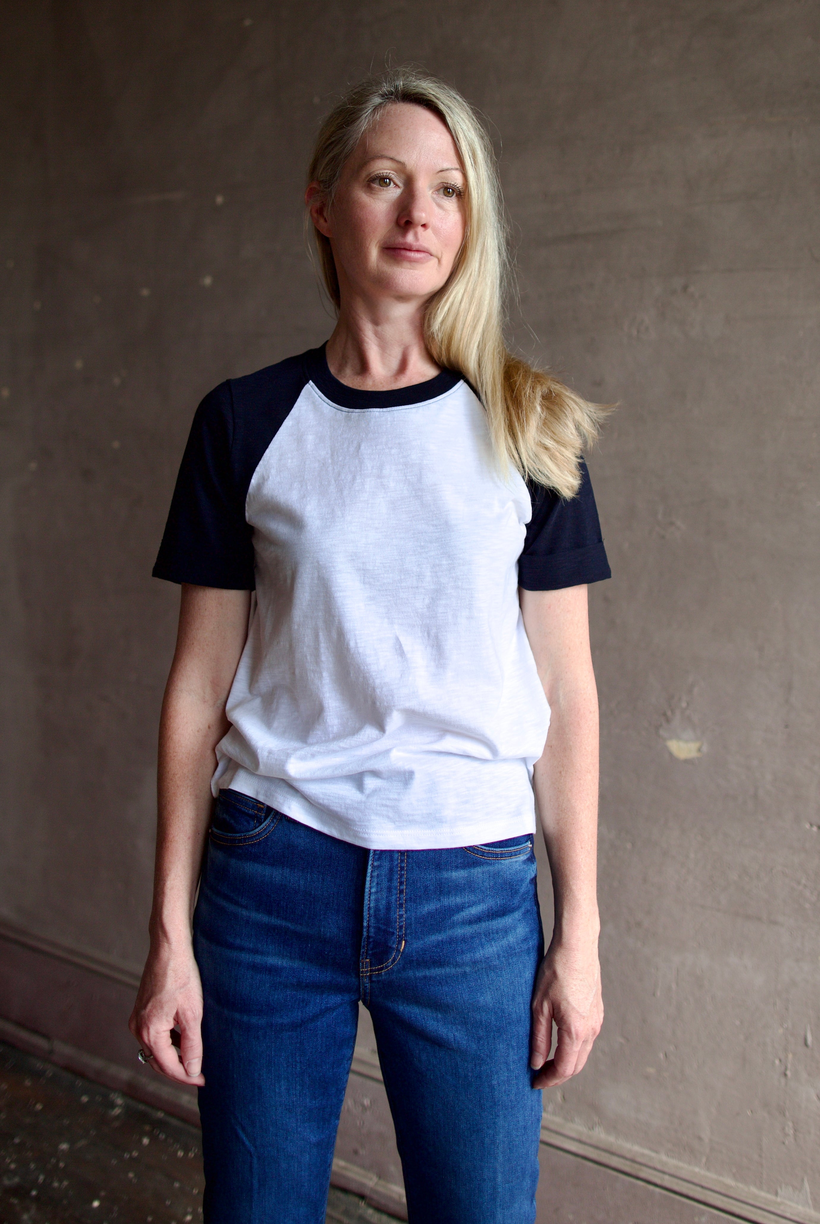Image of a woman wearing the Veronica Beard Mason Baseball Tee and Beverly Jeans