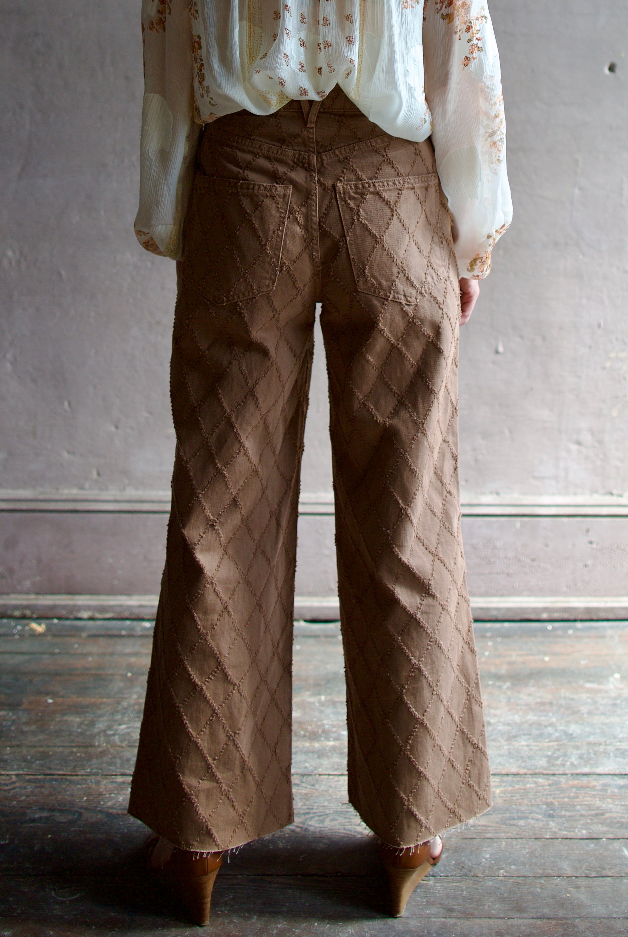 Model wearing the premium Veronica Beard Taylor Cropped Jeans in Hazelnut stone elevated neutral with sophisticated lattice texture