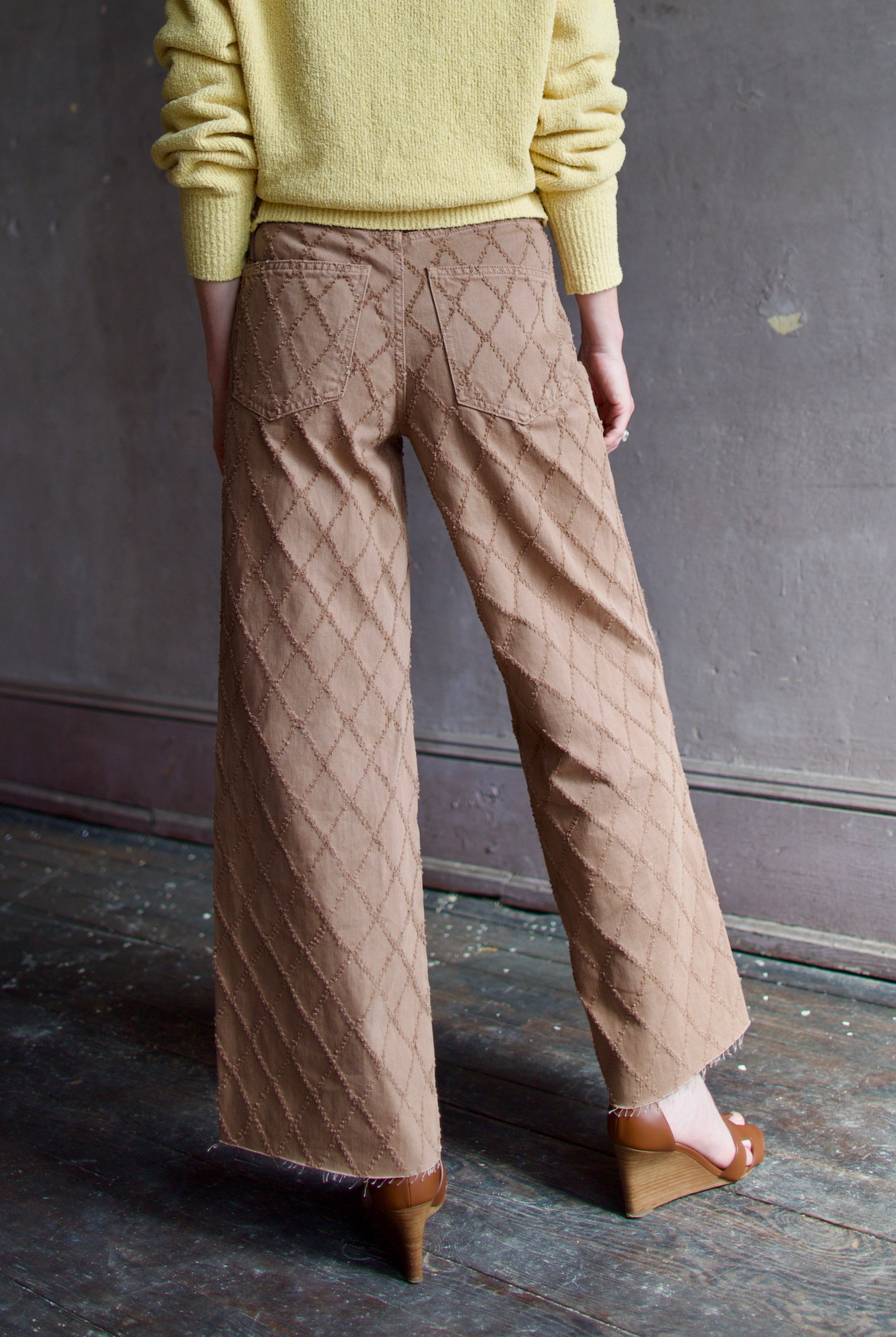 Model wearing the premium Veronica Beard Taylor Cropped Jeans in Hazelnut stone elevated neutral with sophisticated lattice texture