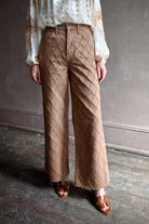 Model wearing the premium Veronica Beard Taylor Cropped Jeans in Hazelnut stone elevated neutral with sophisticated lattice texture