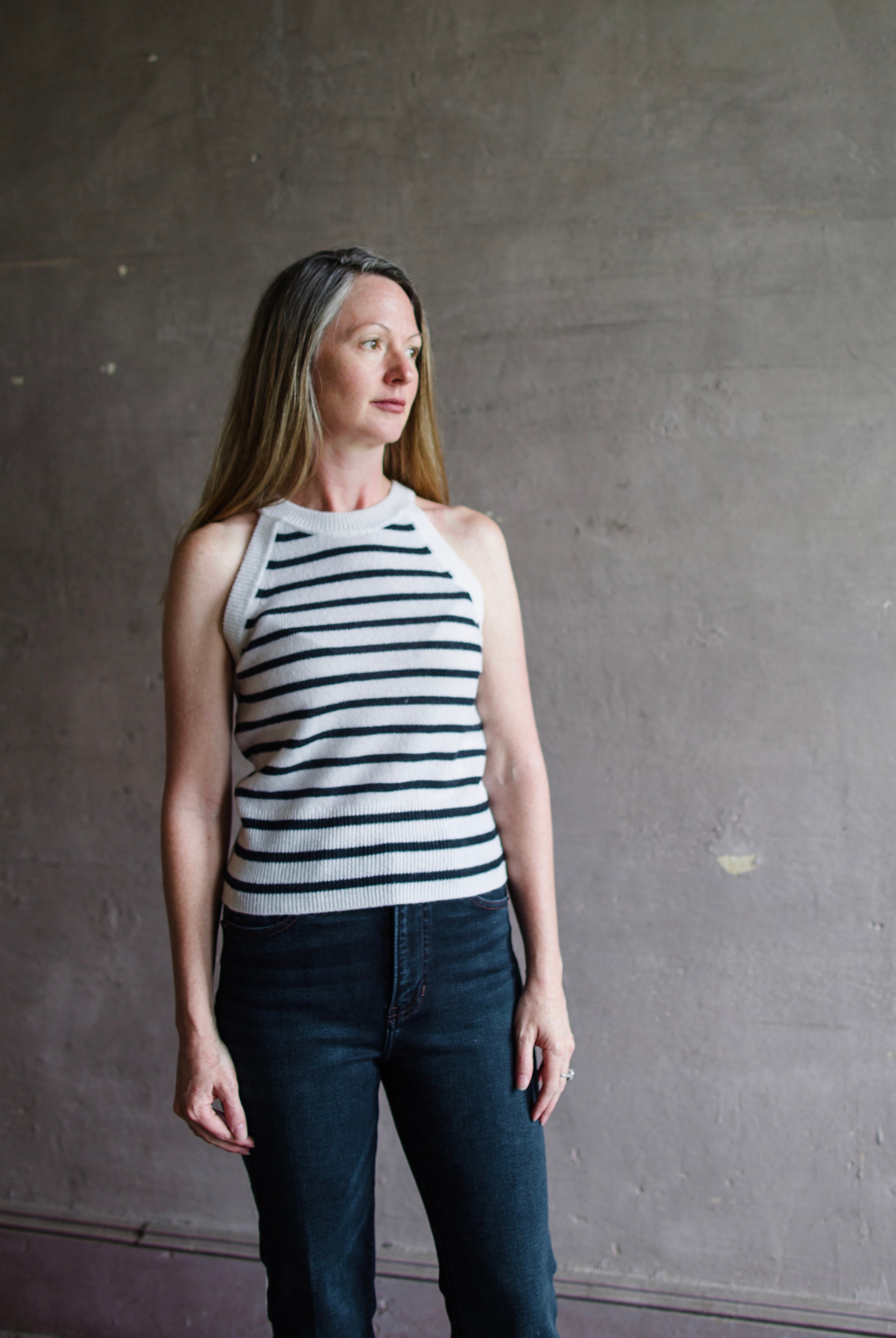 Mature woman wearing Veronica Beard Myrick sleeveless cashmere tank top crew neck Ivory and navy stripe