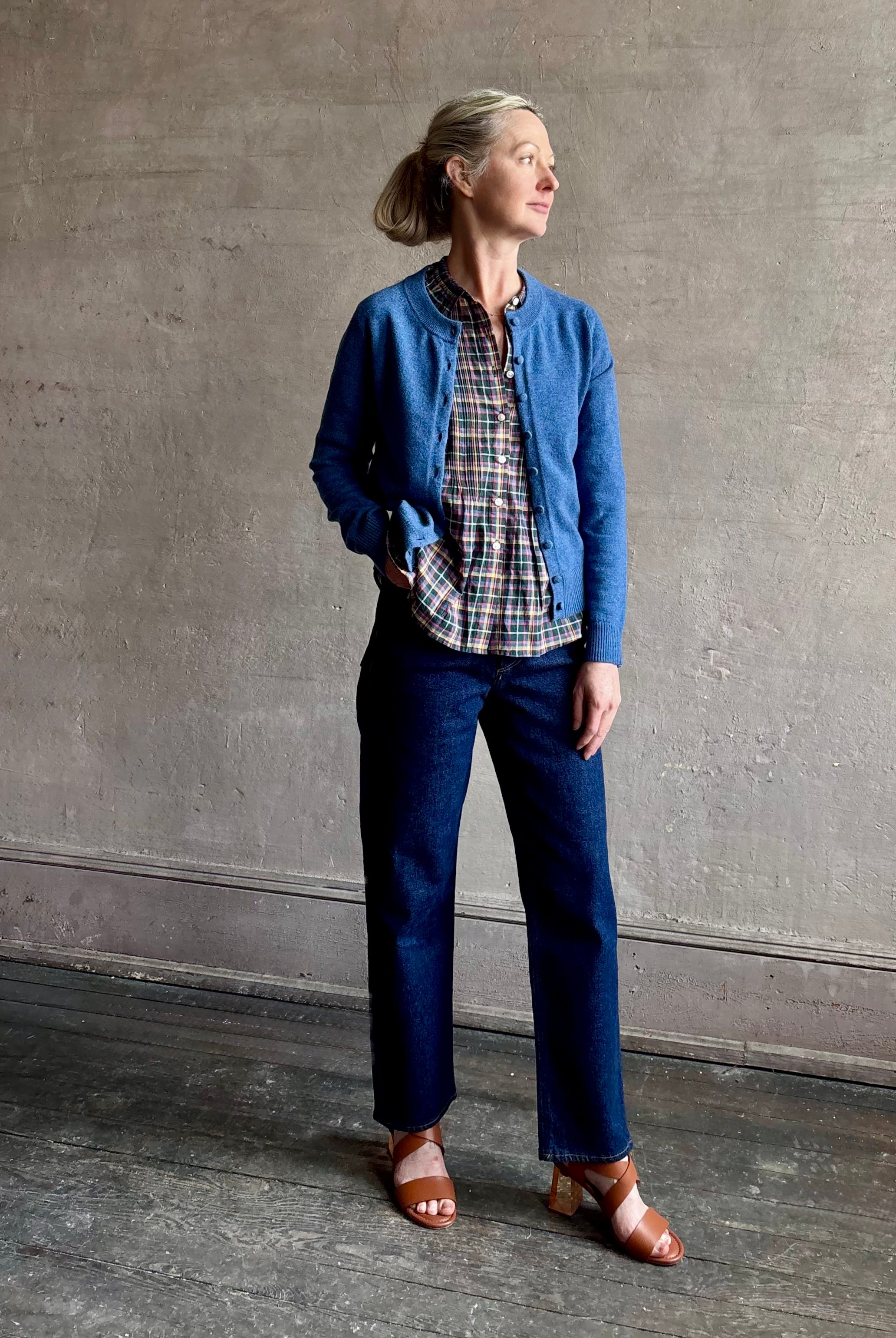 woman wearing designer Veronica Beard Daro Cashmere Cardigan in Blue Coast Melange with long sleeves and covered fabric buttons