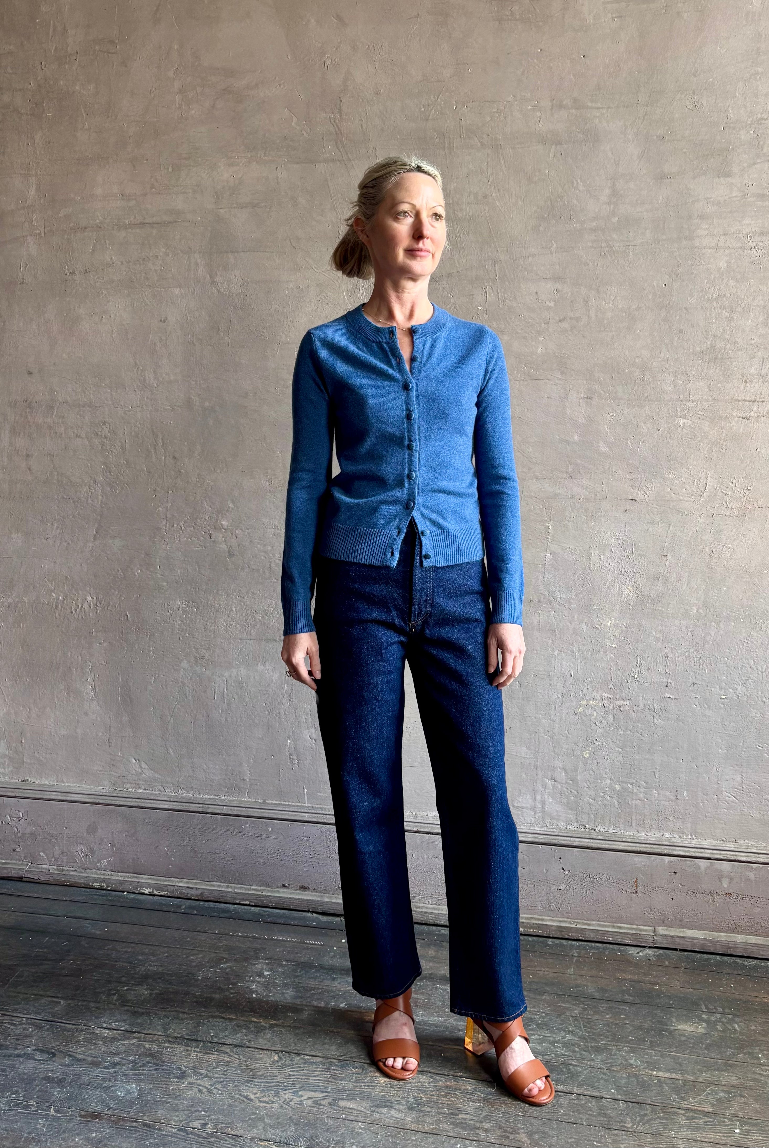 woman wearing designer Veronica Beard Daro Cashmere Cardigan in Blue Coast Melange with long sleeves and covered fabric buttons