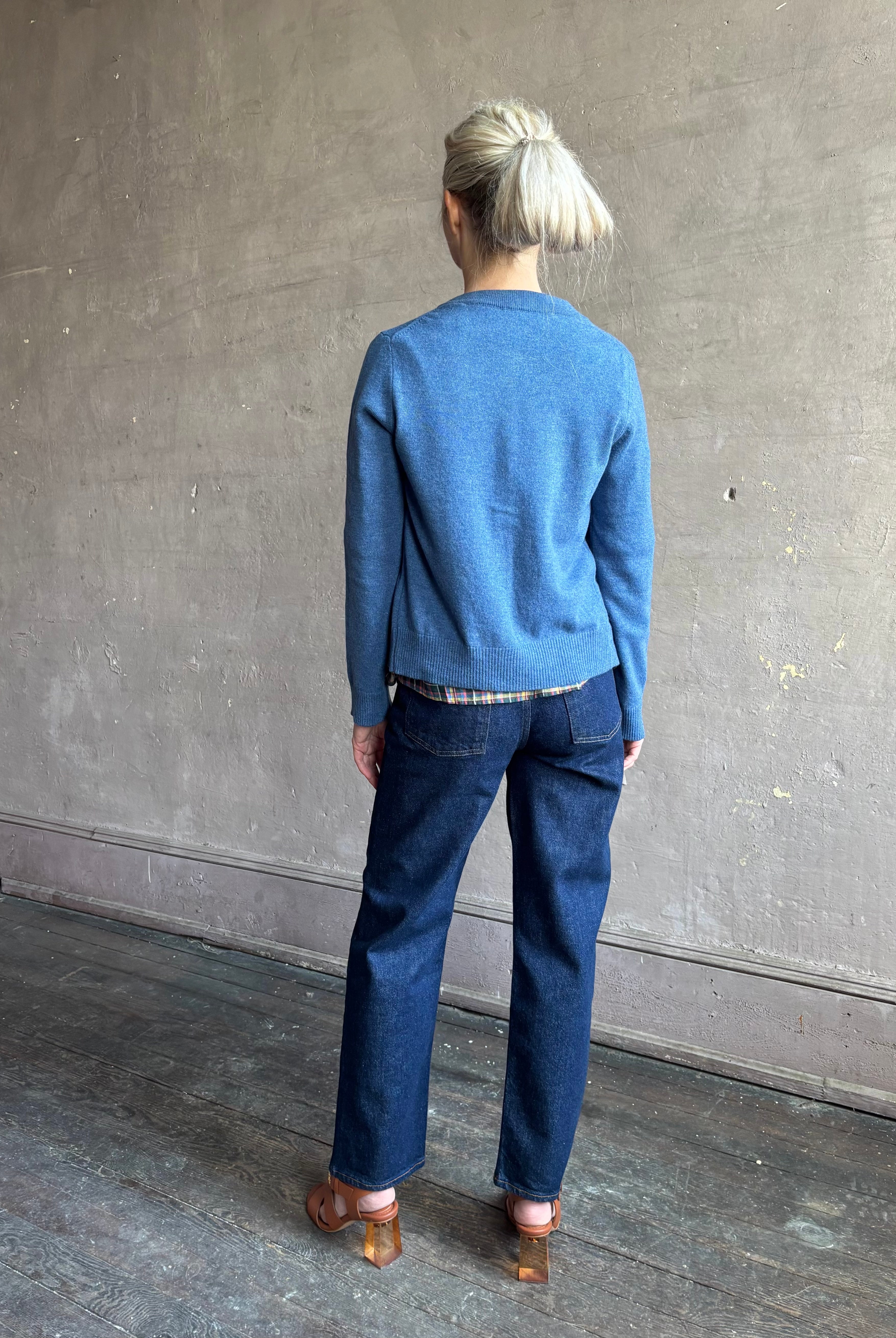 woman wearing designer Veronica Beard Daro Cashmere Cardigan in Blue Coast Melange with long sleeves and covered fabric buttons