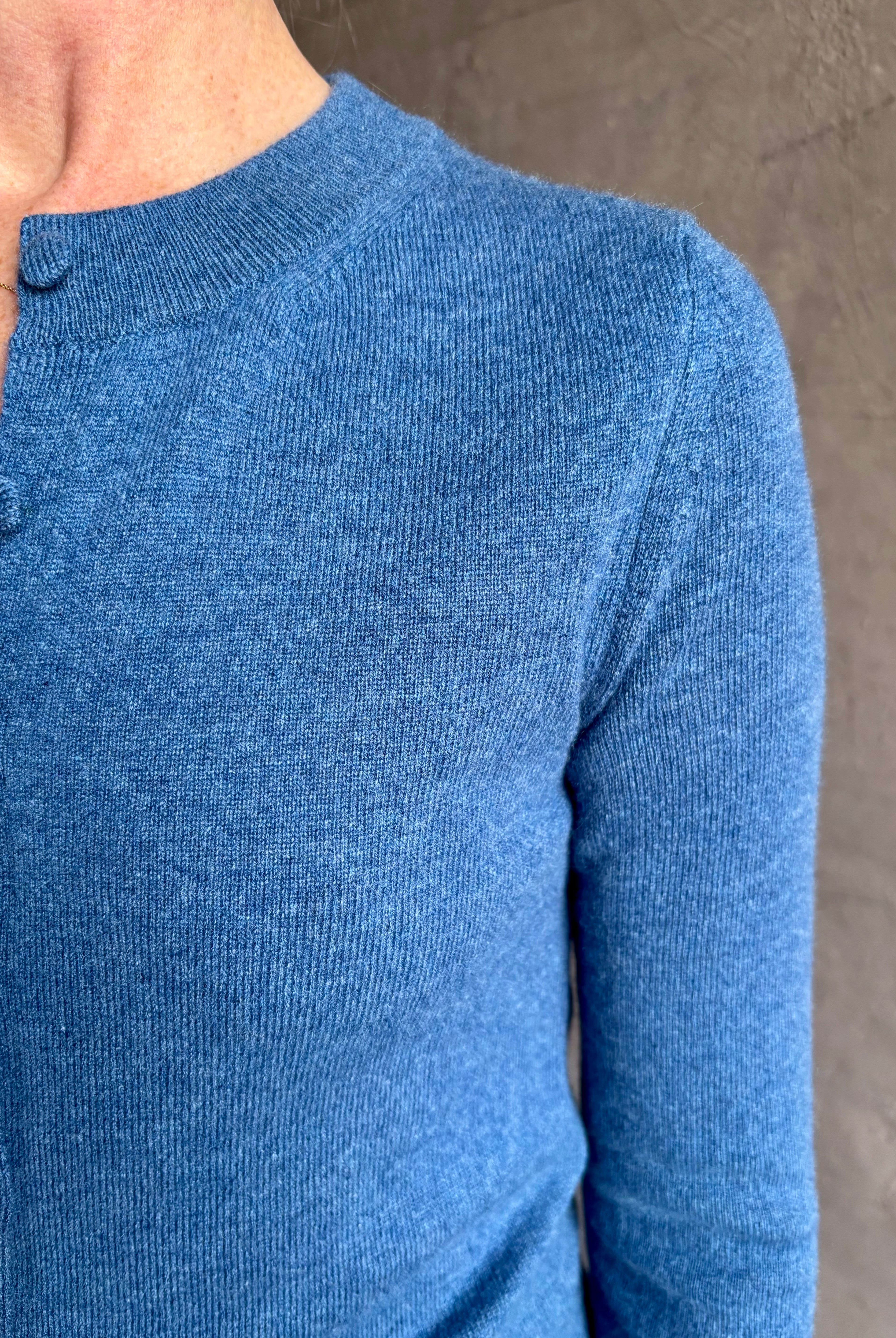 woman wearing designer Veronica Beard Daro Cashmere Cardigan in Blue Coast Melange with long sleeves and tailored fit