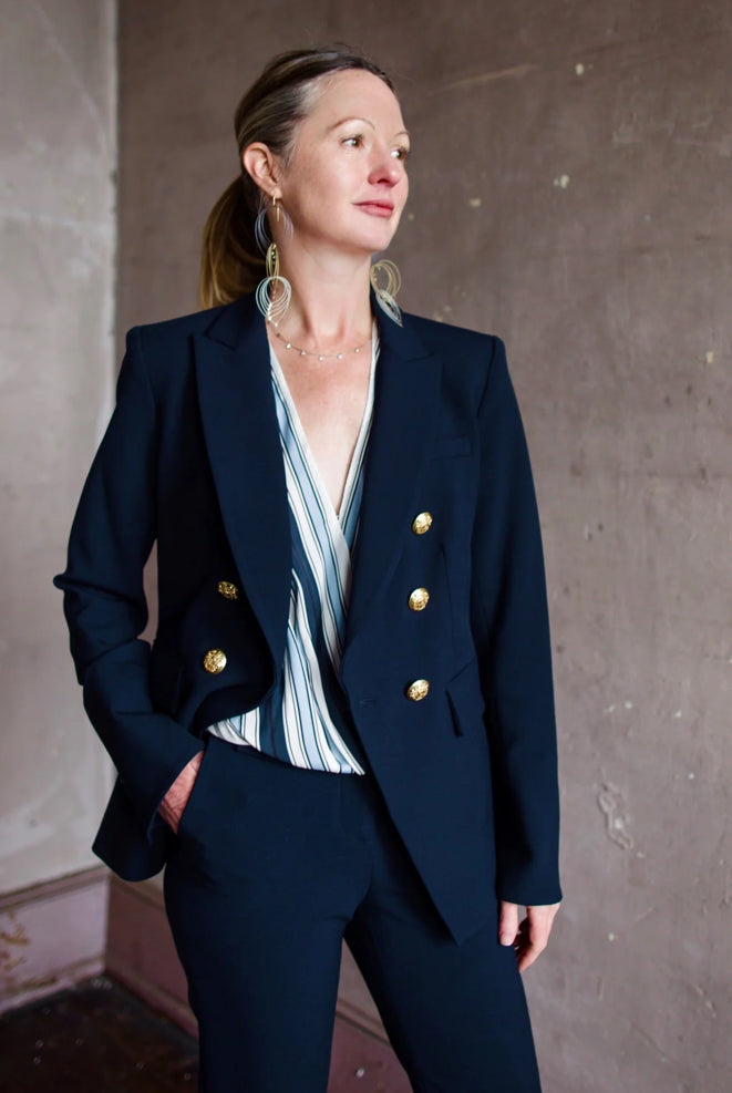 Image featuring a woman wearing the Veronica Beard Miller Dickey Jacket with Gold Buttons in Navy blue.