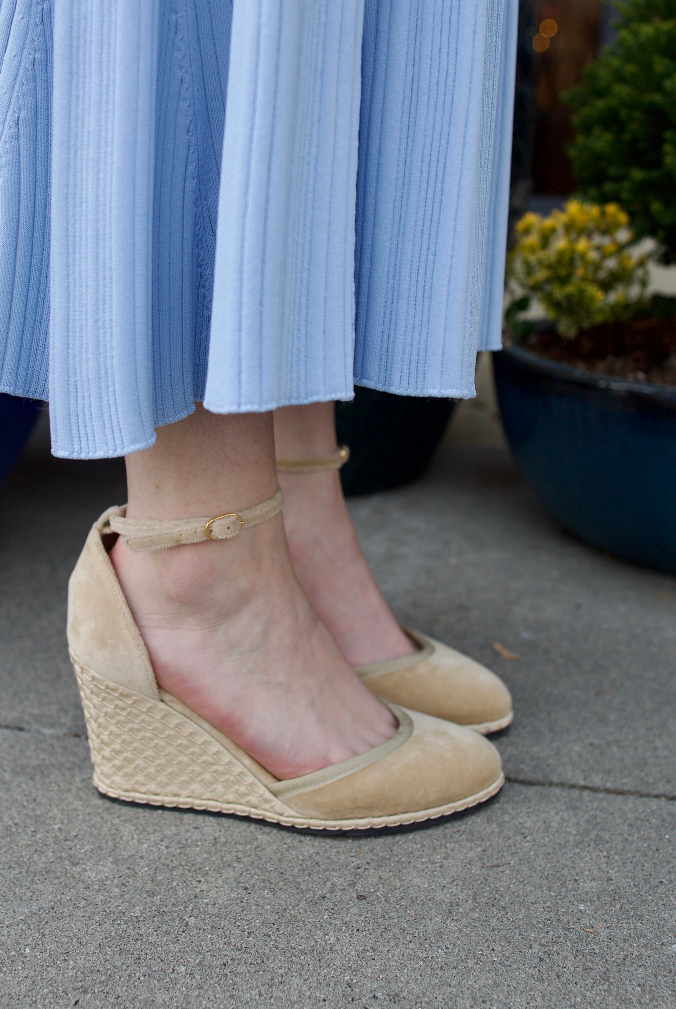 A pair of beige Vibi espadrille wedge heels in beautiful neutral velvet with ankle straps and buckle closures.
