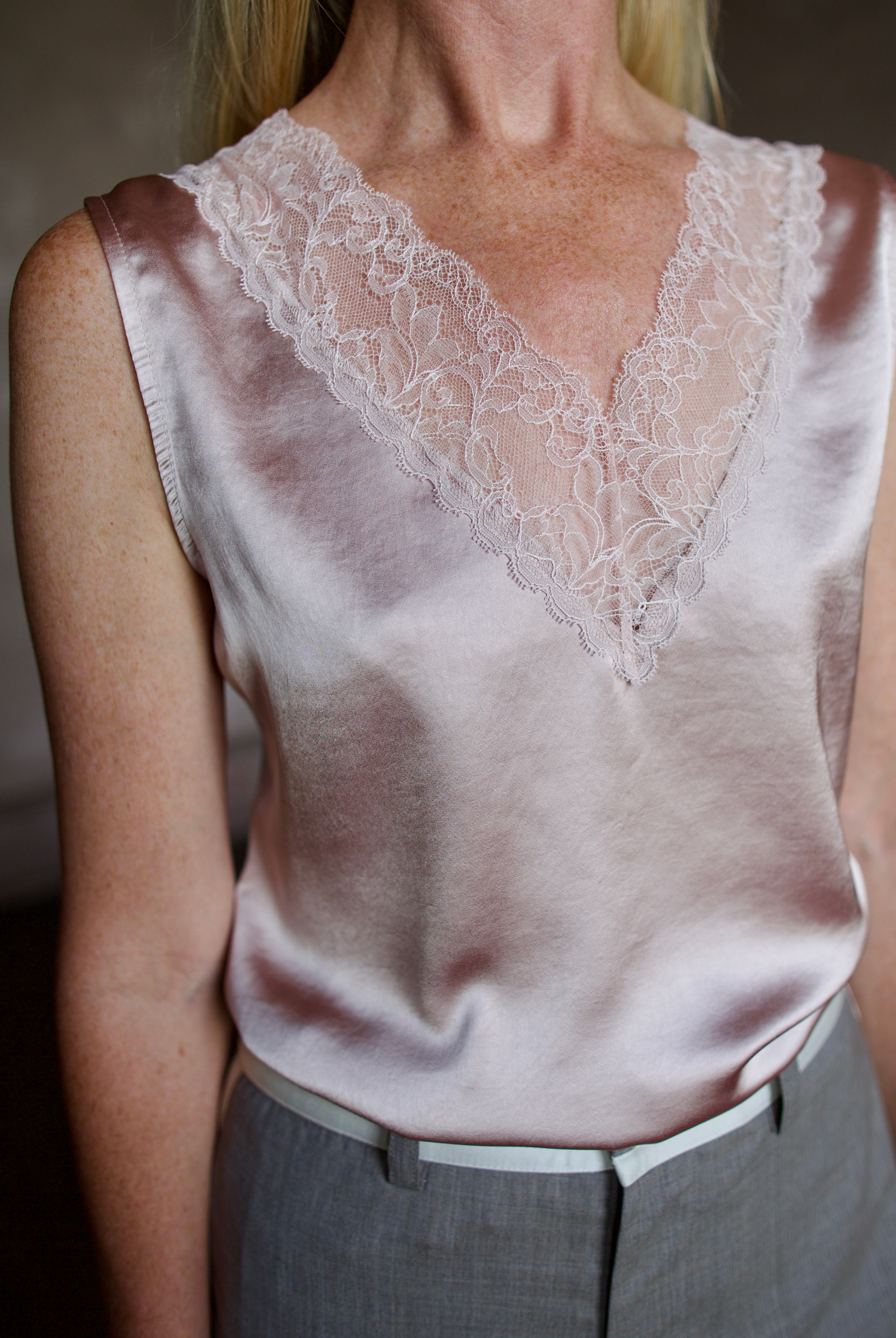 Mature model wearing a bra friendly camisole top with lace detailing at neckline by WE-R4