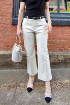 Mature women wearing luxury women's ALC Jay timeless pant in cotton blend mid rise with straight, cropped leg and pintuck detailing