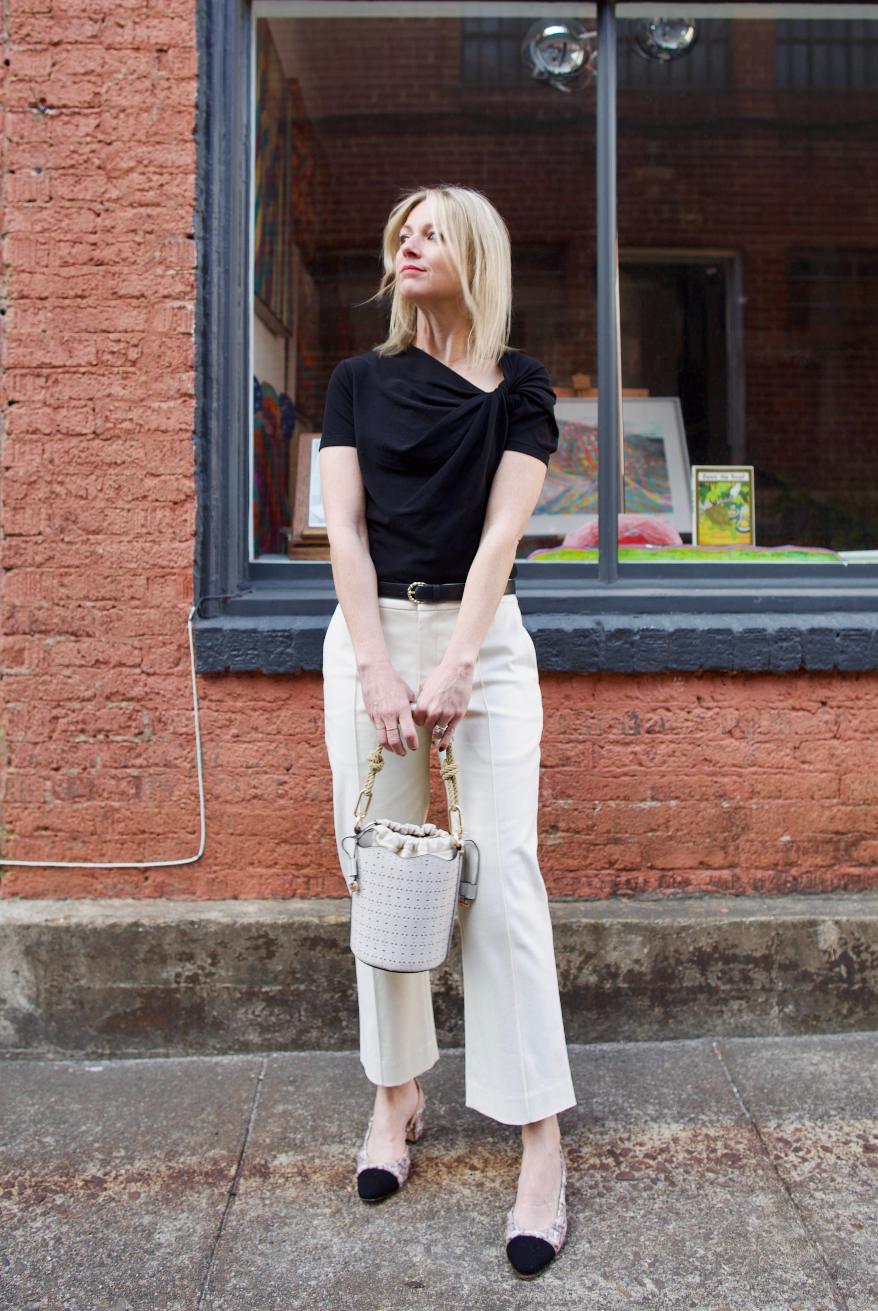 Mature women wearing luxury women's ALC Jay tailored trouser in cotton blend mid rise with straight, cropped leg and pintuck detailing