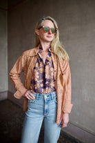 Image of woman wearing the alix of bohemia ondine mocha lace shirt showcasing artisanal sophistication through premium cotton construction