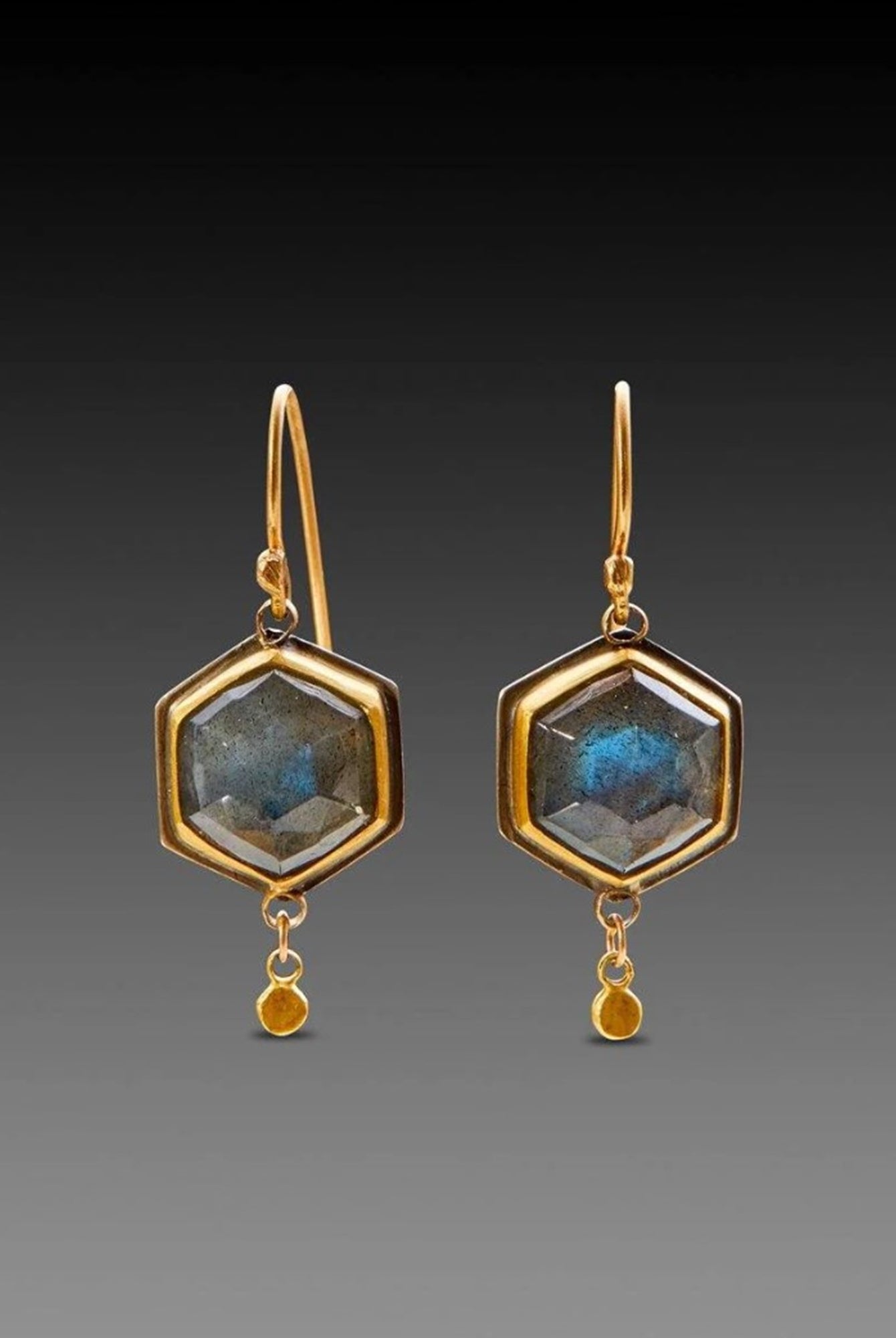 Image of pair of rosecut labradorite hexagon drop earrings with 22kt gold bezel and 18kt gold earwire by American jeweler Ananda Khalsa
