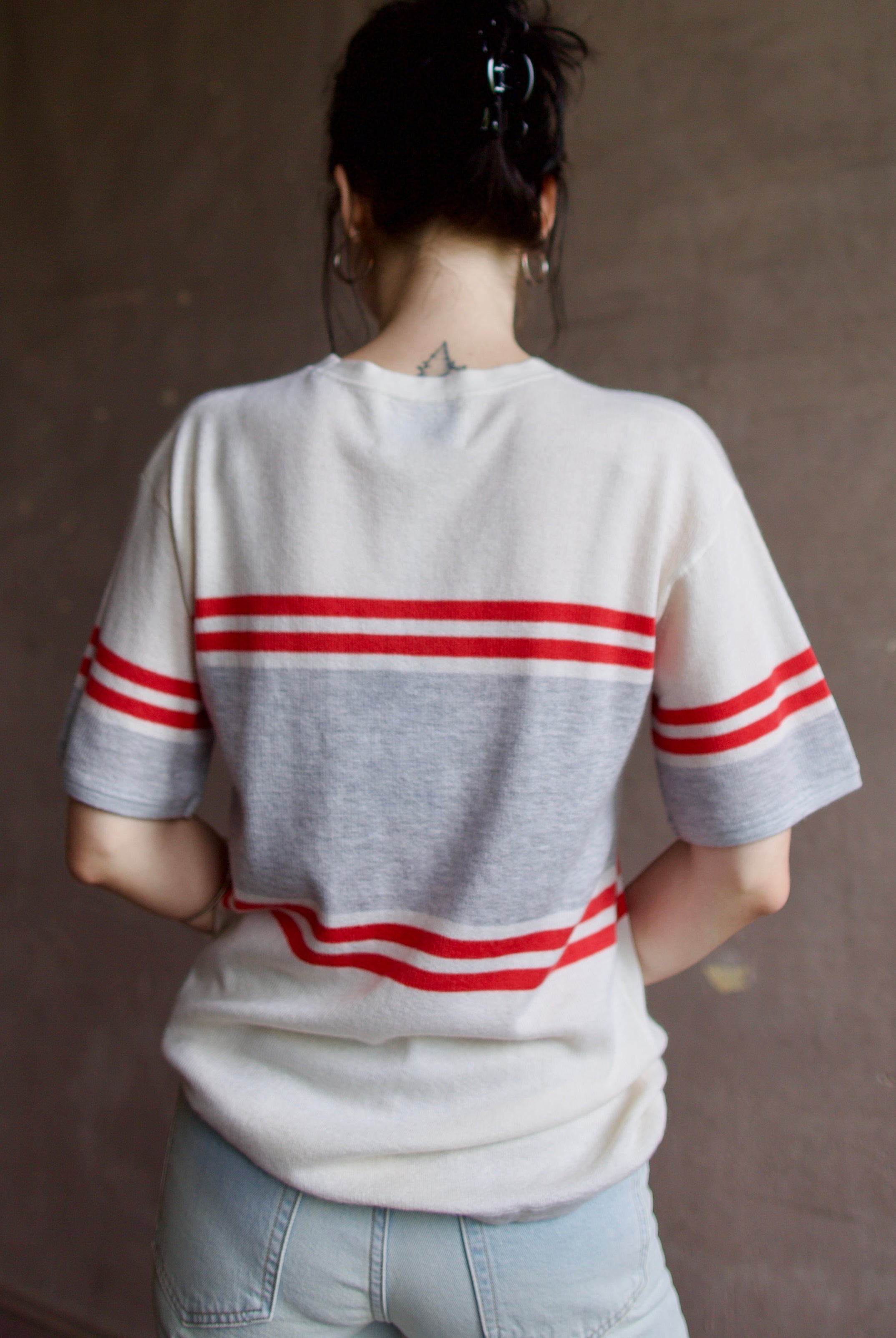 Model wearing luxury US designer TWP Engineered Striped Big Boy Tee and the Ulla Johnson Gwynne Jeans