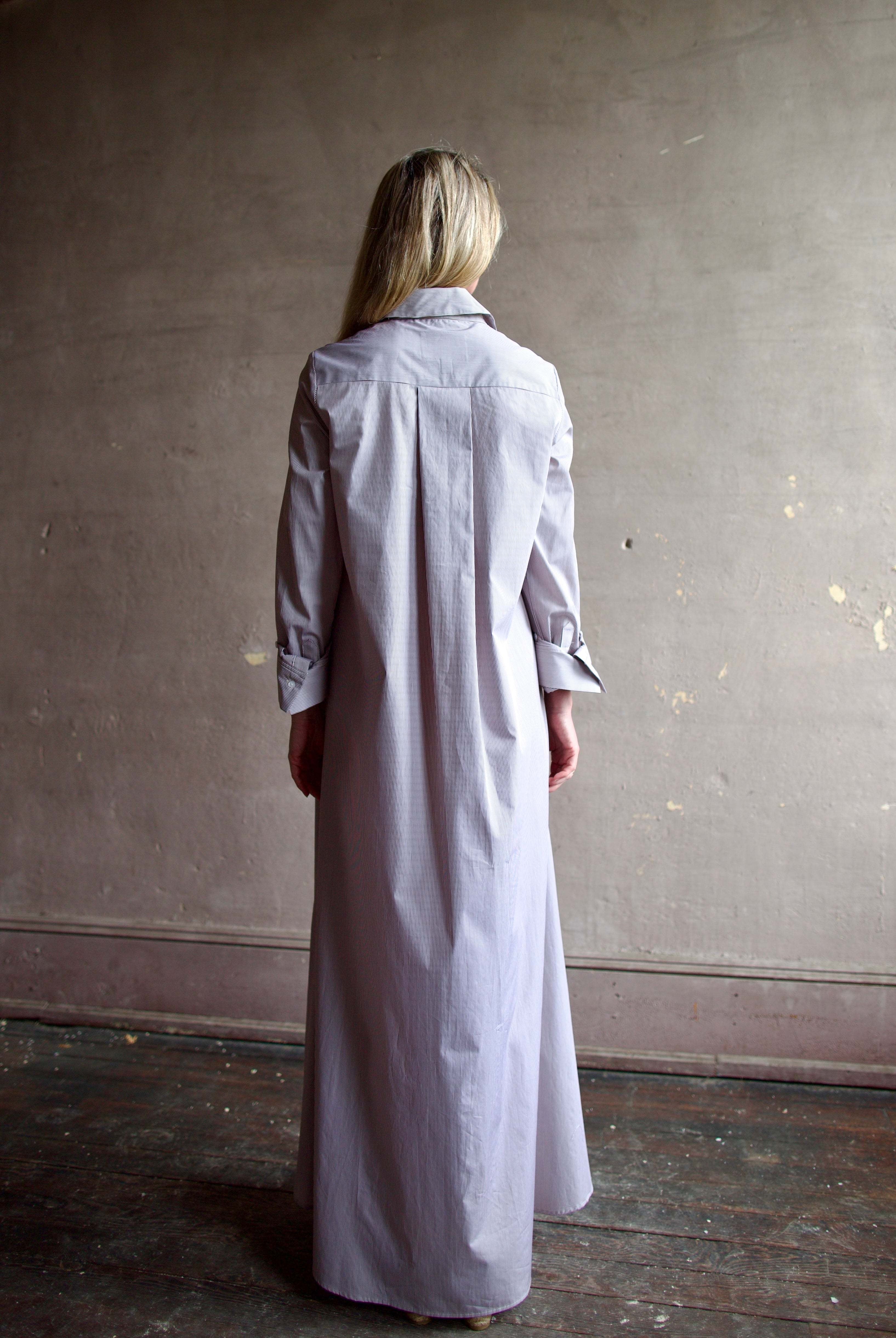 Model wearing luxury TWP Jenny's Gown in Brown Stripe effortless sophistication in comfortable premium cotton