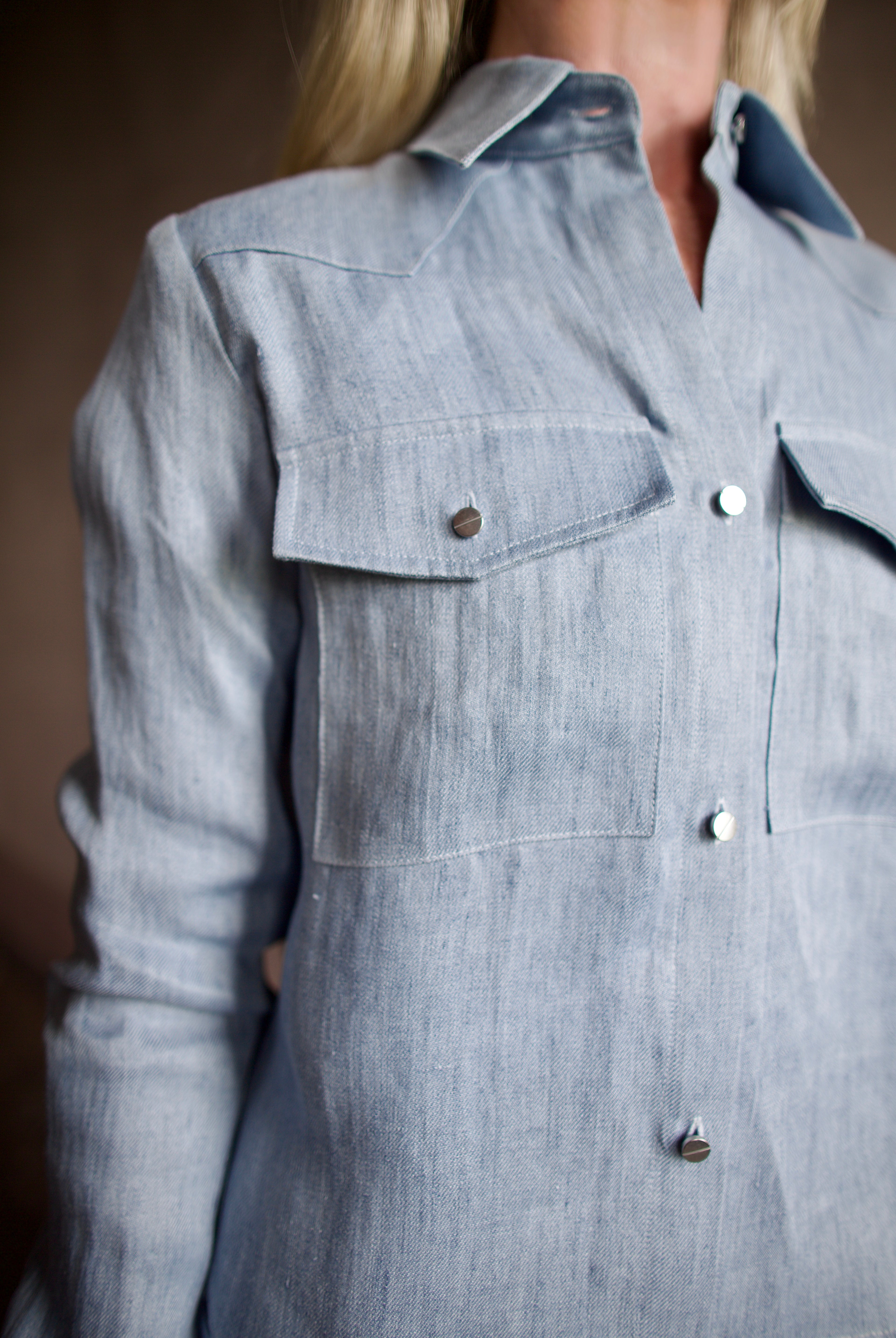 Image of model wearing luxury TWP New Carter indigo Button Up hemp top combining timeless workwear with contemporary refinement