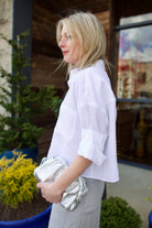 Model wearing luxury brand TWP Next Ex white Linen Top, sophisticated and comfort timeless elegance in an elevated basic