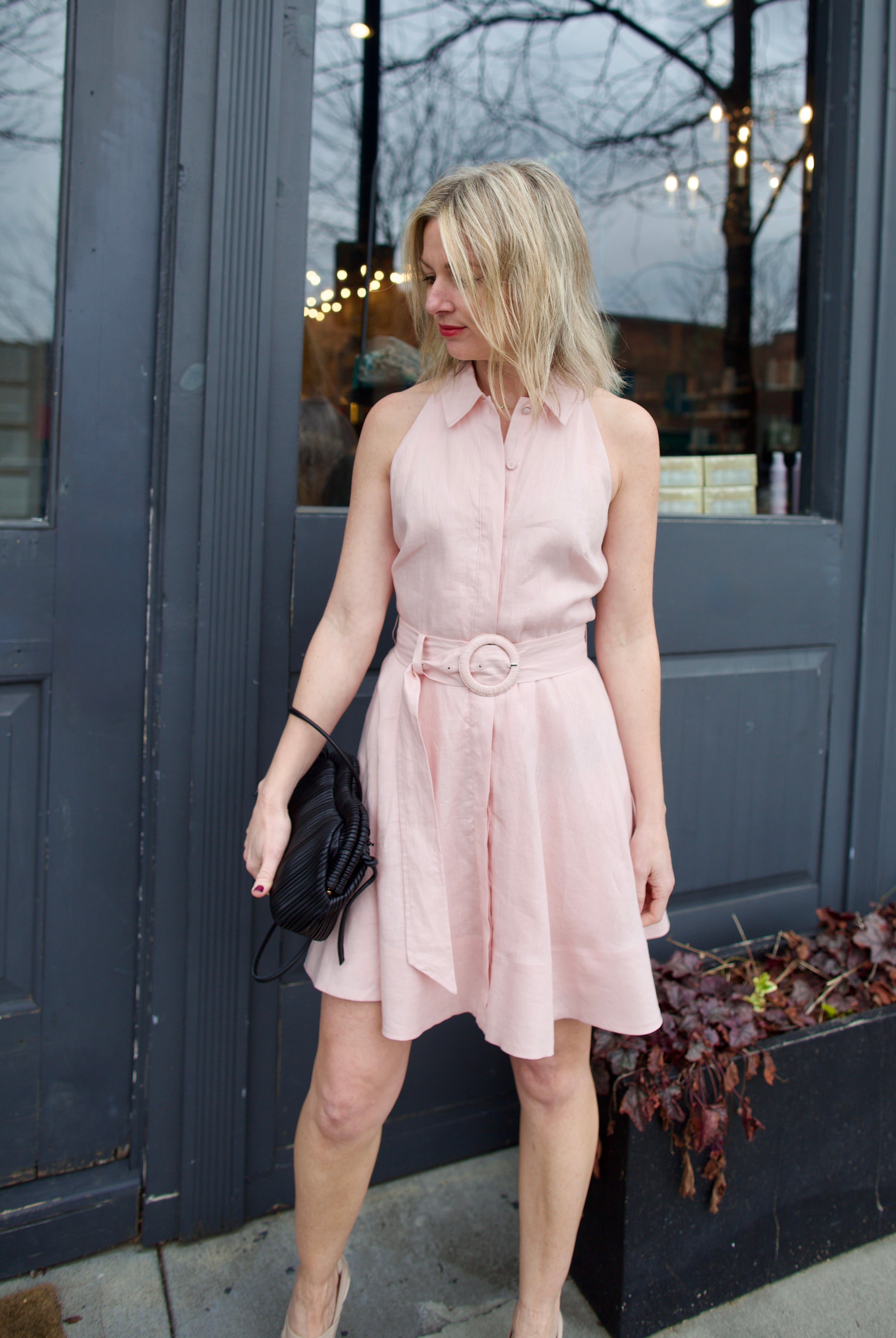 Mature woman wearing luxury women's Veronica Beard timeless linen Beau short dress with flowy skirt in expert American craftsmanship