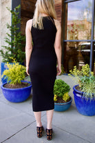 Back image of a woman wearing the Veronica Beard Nelson Tank and Tanner Skirt