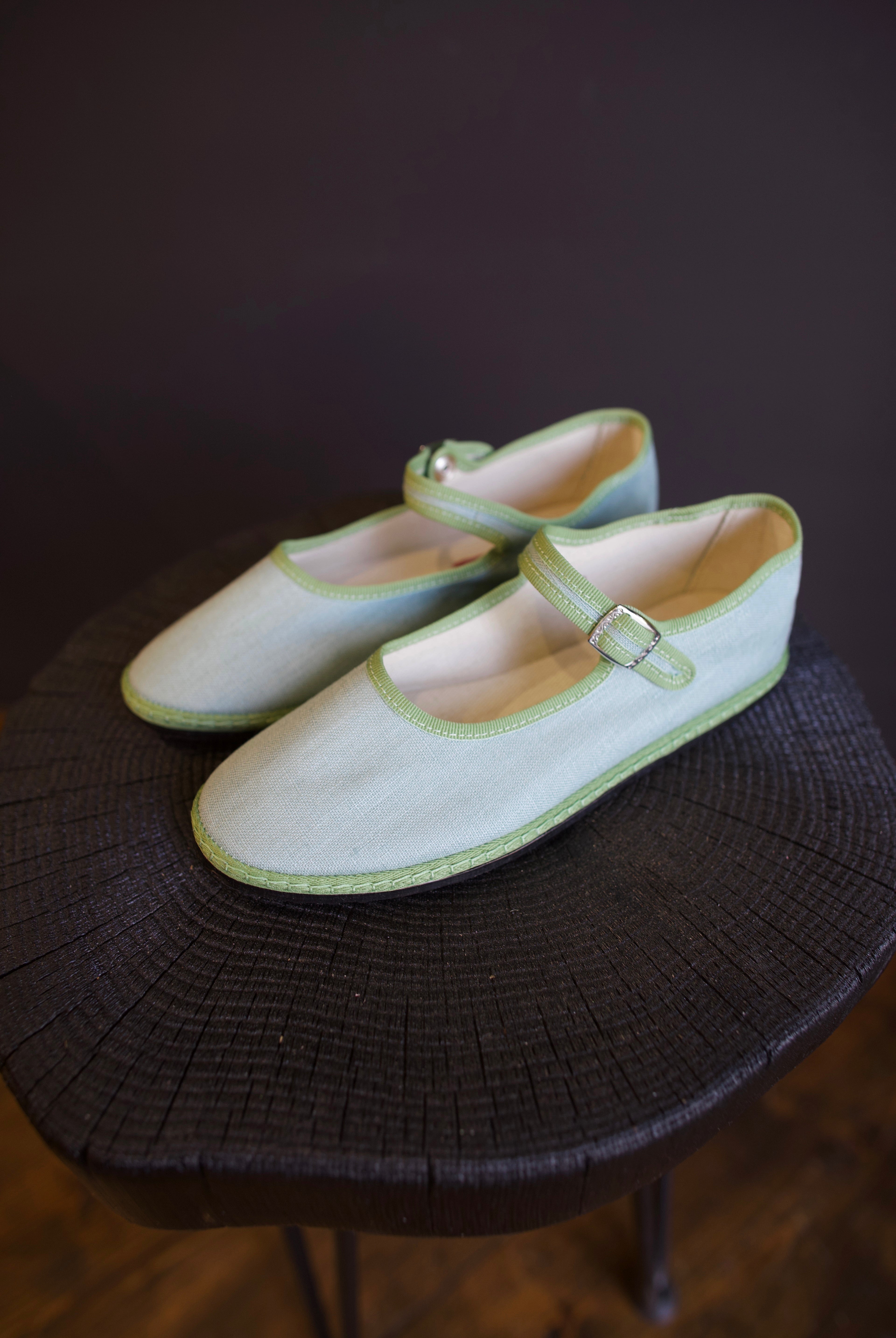 Image of the Vibi Classic Mary Janes in Alicudi colorway that's aqua with green trim with upcycled flexible tire soles comfortable with adjustable hidden snap strap