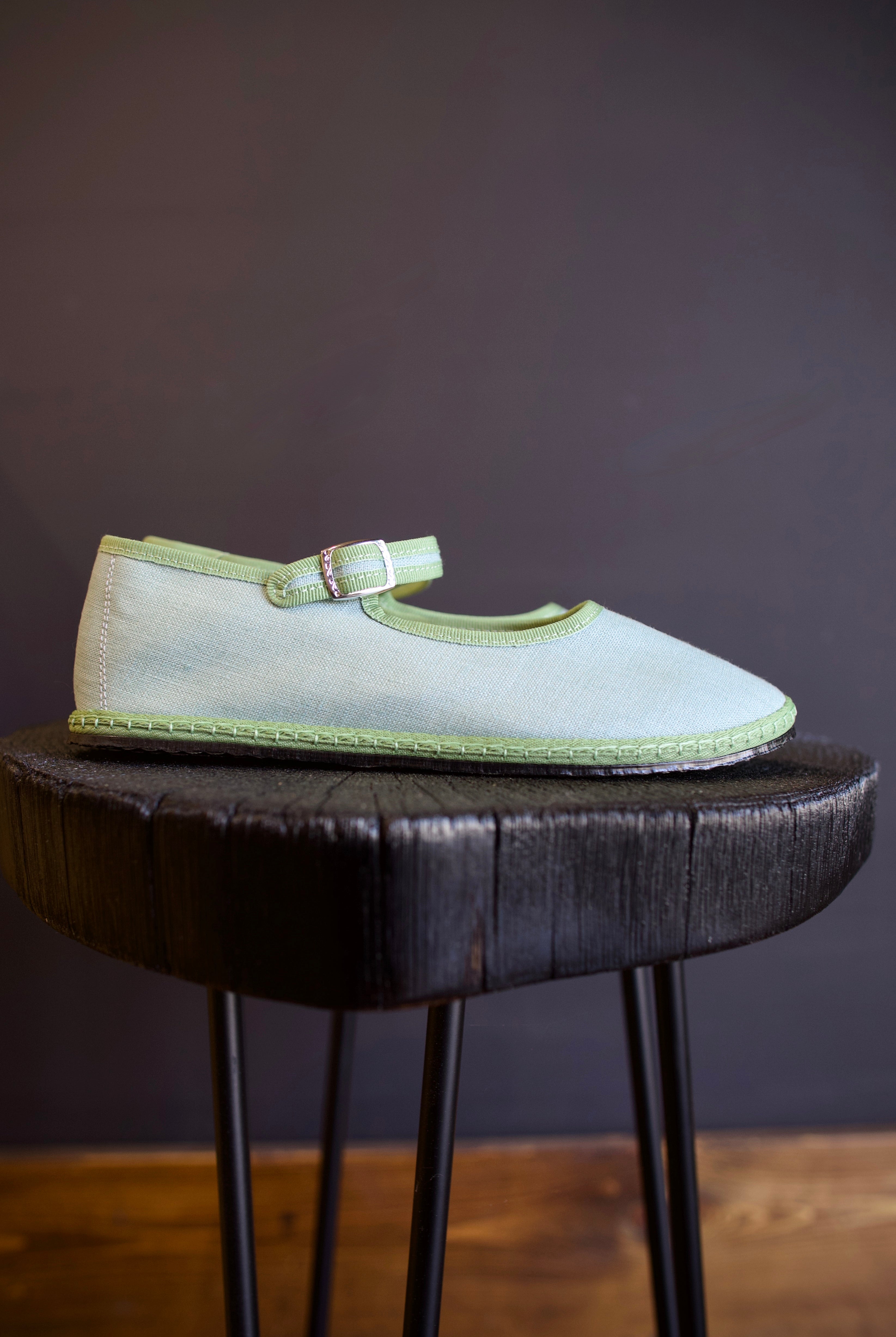 Image of the Vibi Classic Mary Janes in Alicudi colorway that's aqua with green trim with upcycled flexible tire soles comfortable with adjustable hidden snap strap