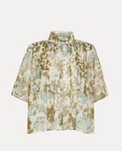 Image of the bloom mist top by Forte Forte features a stand up collar with short sleeves and pleating in a cotton silk green floral print.