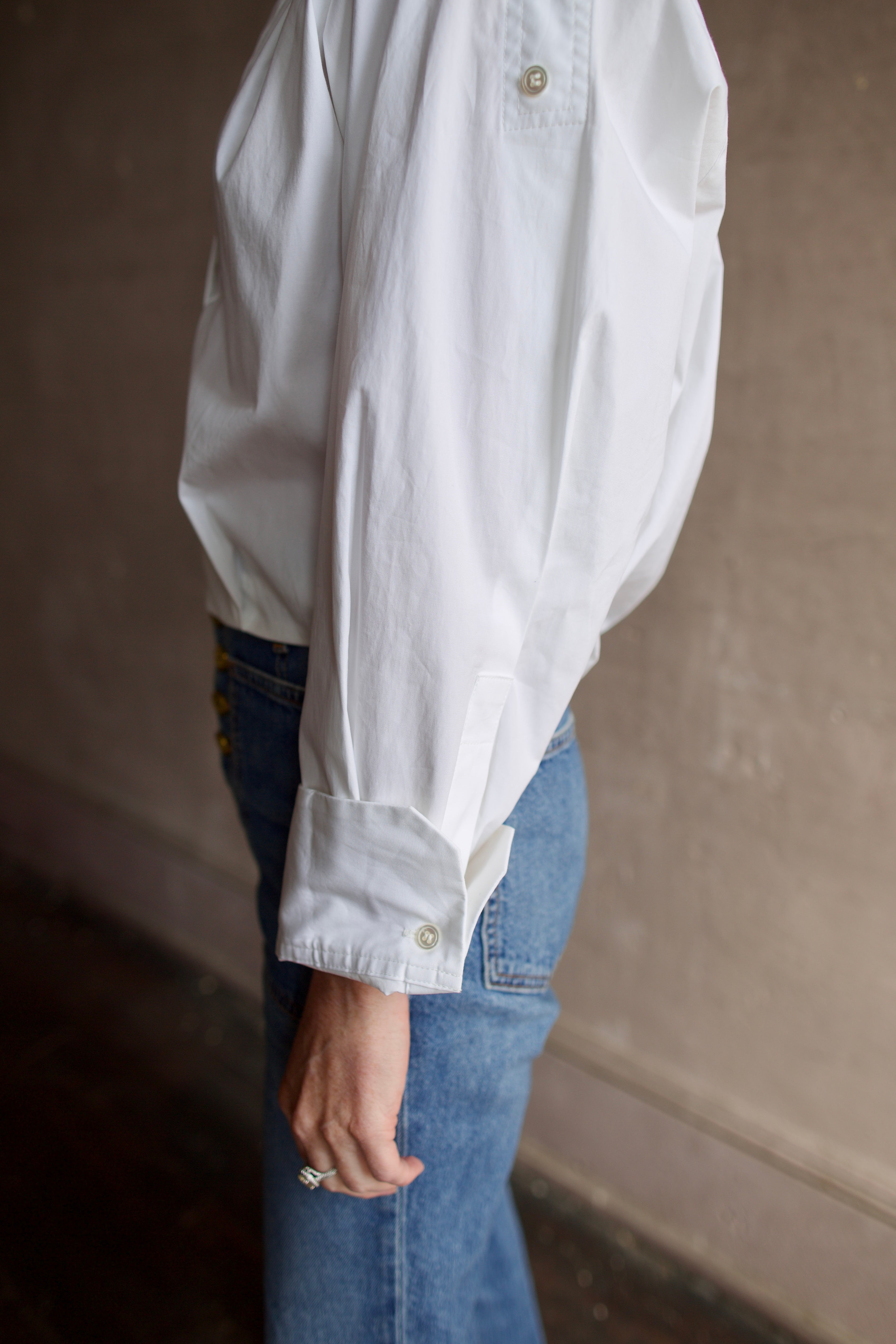 Mature woman wearing A.L.C. Jordan long sleeve white Top in premium cotton blend