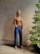 Mature woman wearing Agolde 90's Pinch Waist Crop with regenerative cotton zip closure finished hem