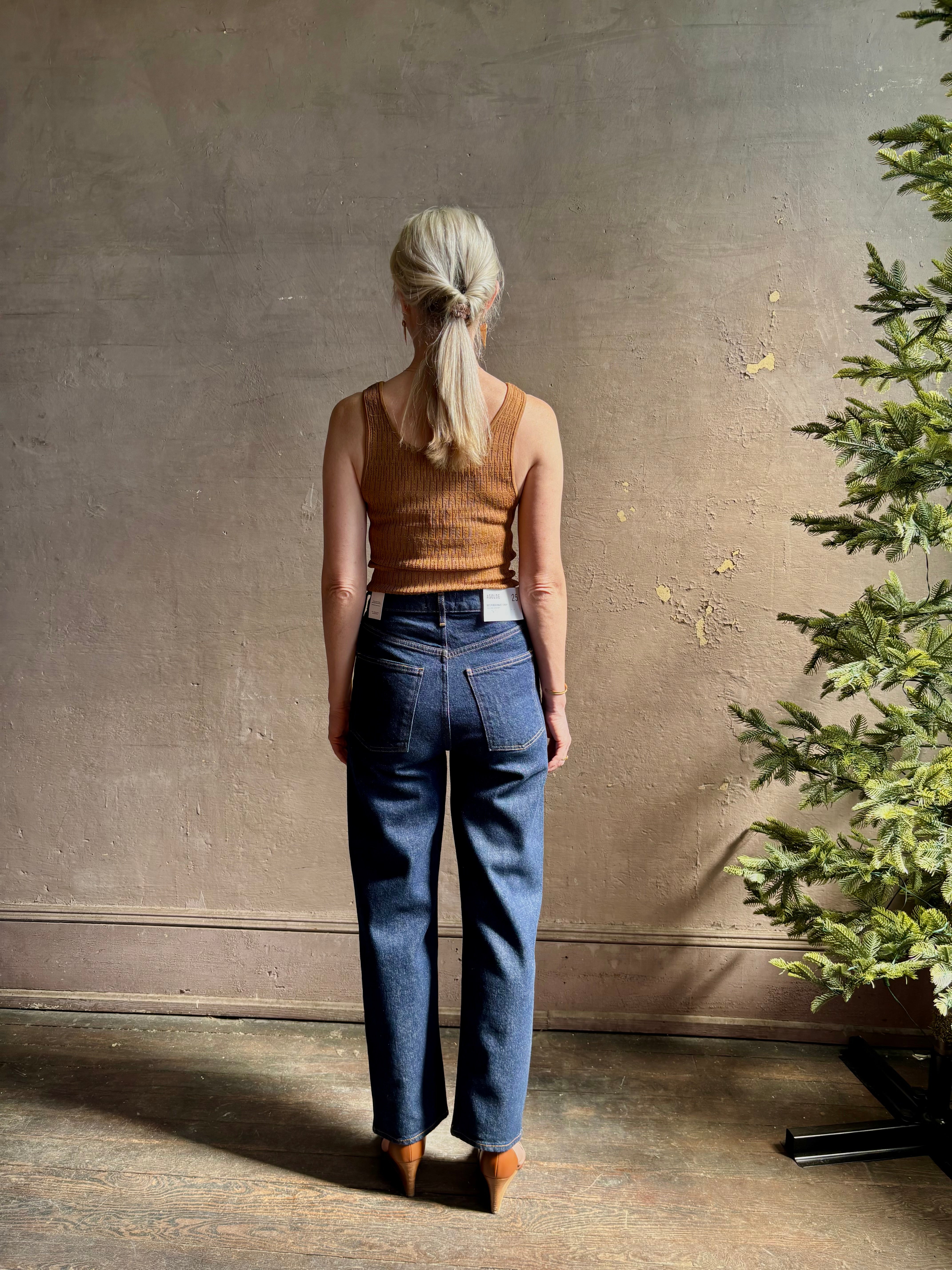 Mature woman wearing Agolde 90's Pinch Waist Crop with regenerative cotton zip closure no distressing