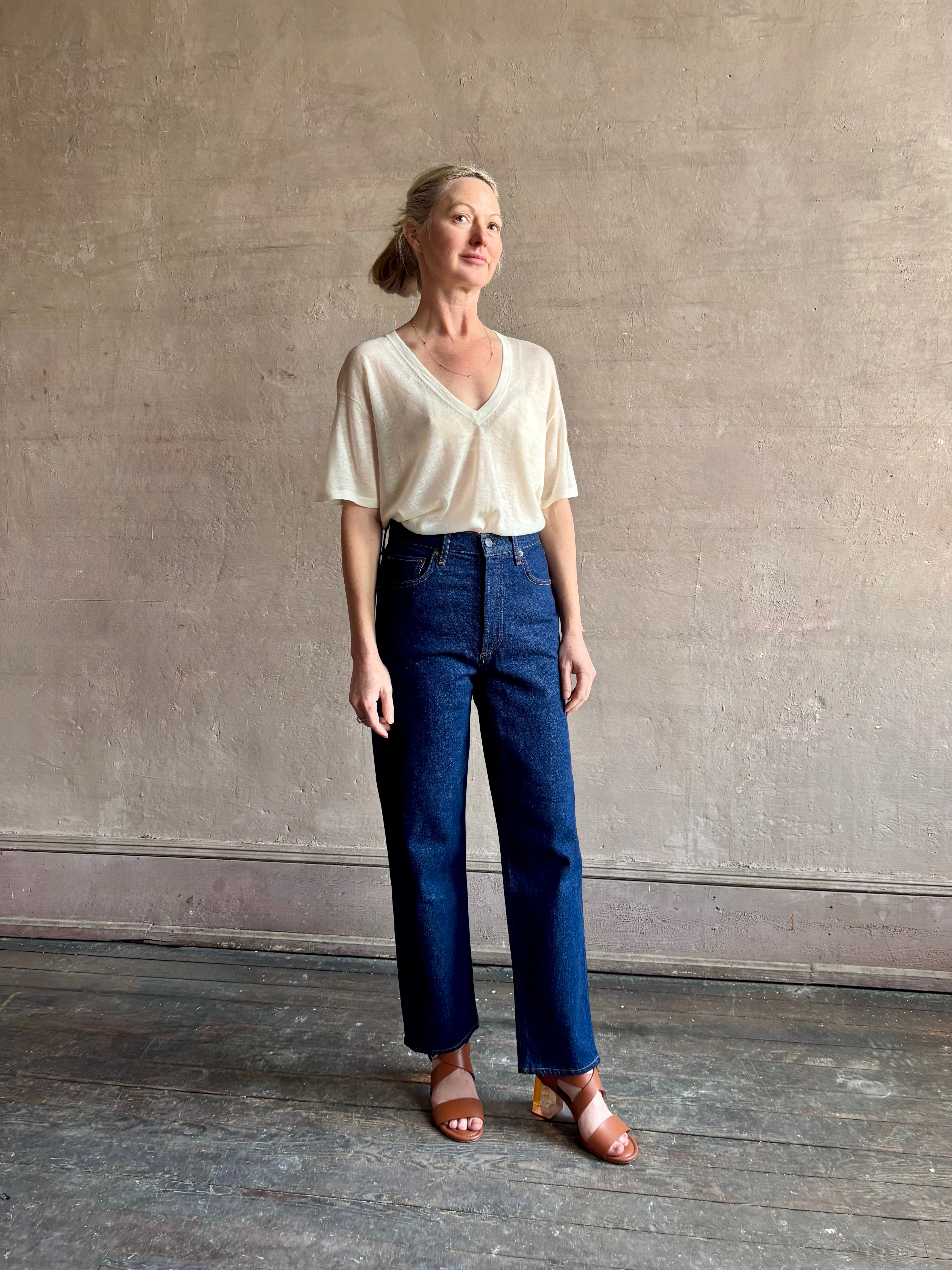 Image of woman wearing premium AGOLDE 90's Pinch Waist Crop in Reissue dark wash with high rise finished hem and slight taper straight leg