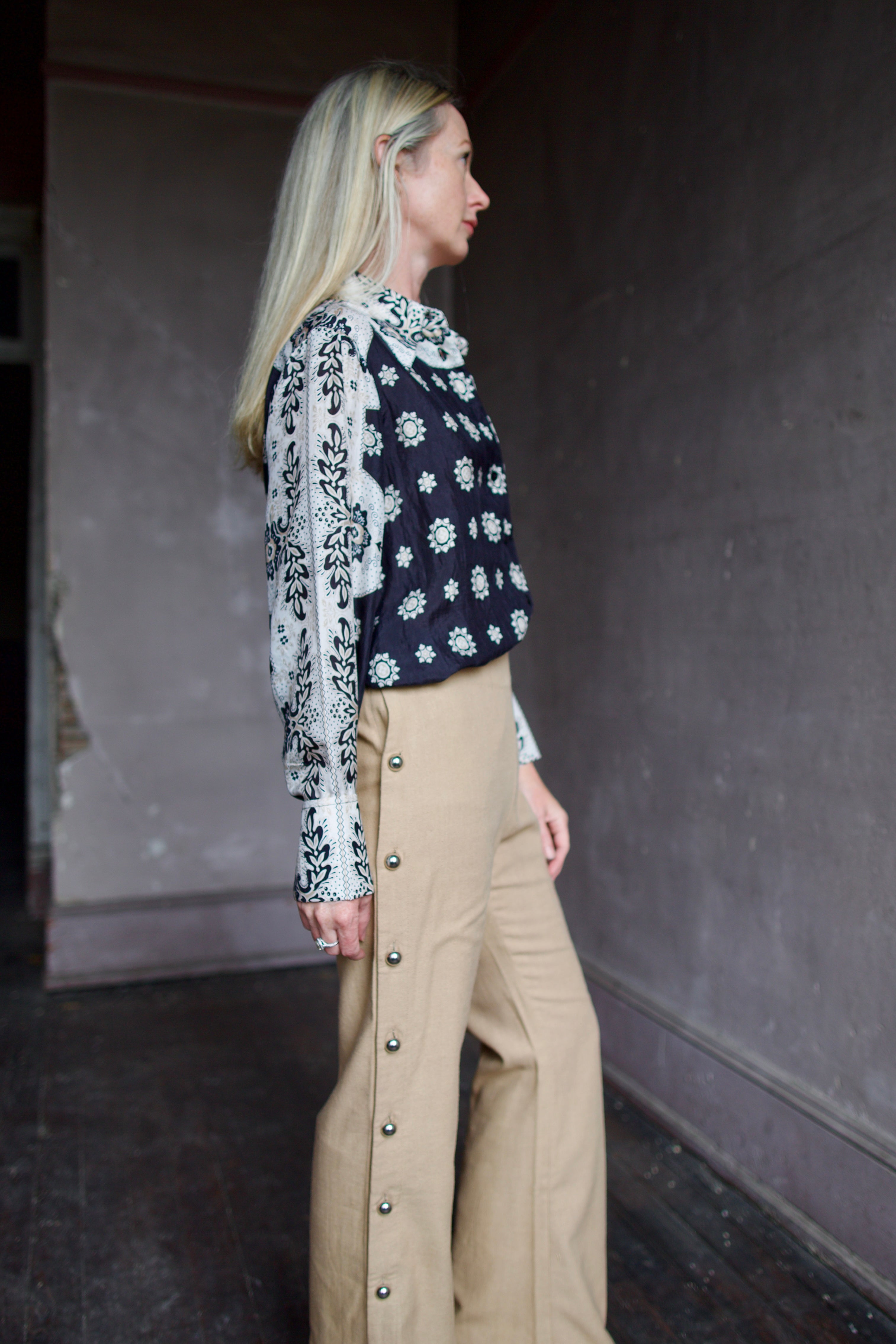 Model wearing an Alix of Bohemia bandana blouse and silk beige Alix trousers