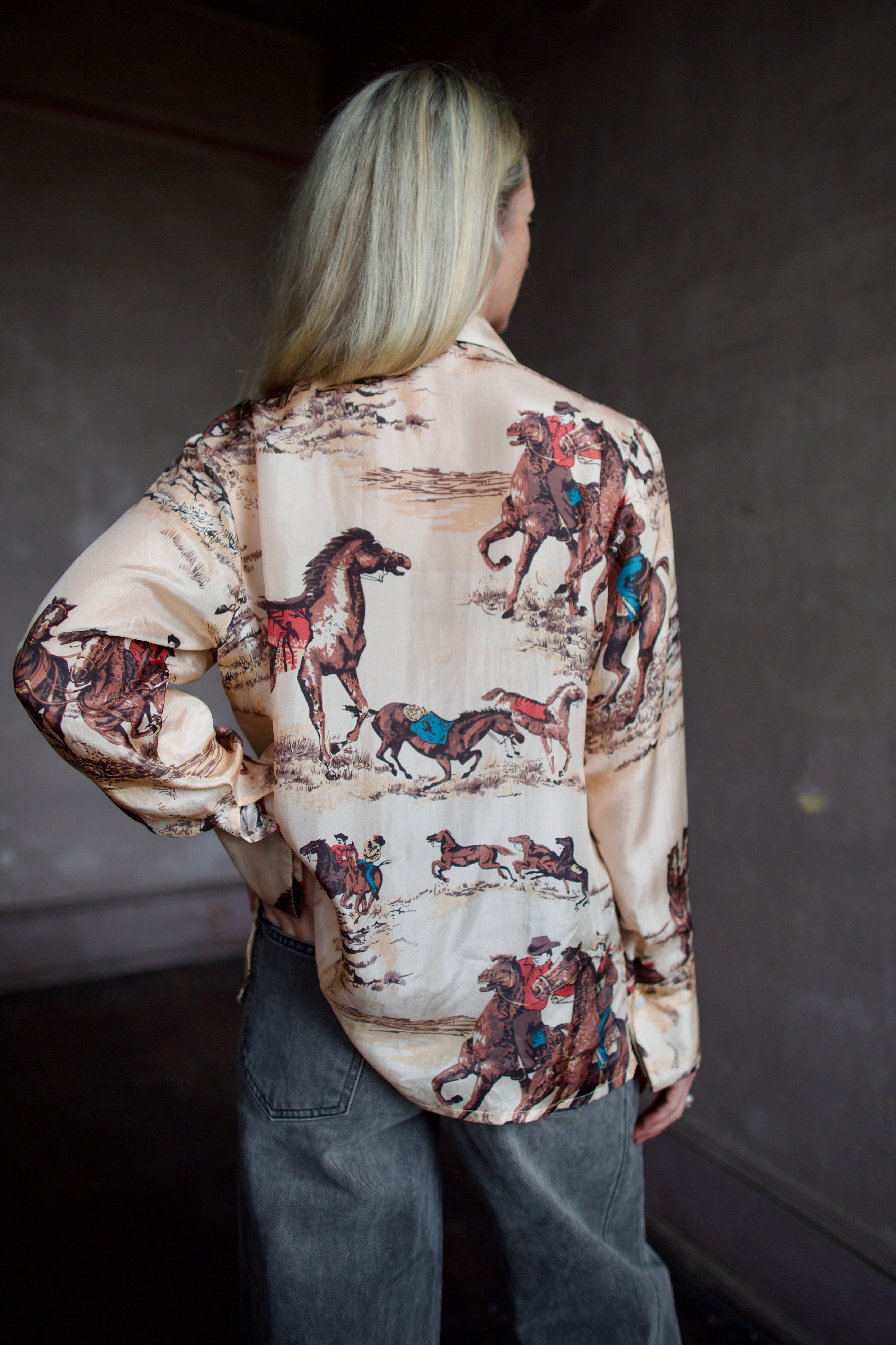 Back of a hand woven western Alix of Bohemia blouse with Veronica Beard grey barrel jeans 
