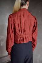 Model wearing Alix of Bohemia Ryland Saddle Shirt. Blouse has classic Edwardian design with premium silk construction and expert pleating techniques.