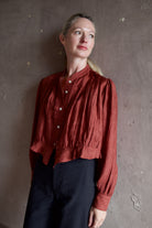 Model wearing Alix of Bohemia Ryland Saddle Shirt. Blouse has classic Edwardian design with premium silk construction and expert pleating techniques.