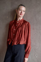 Model wearing Alix of Bohemia Ryland Saddle Shirt. Blouse has classic Edwardian design with premium silk construction and expert pleating techniques.