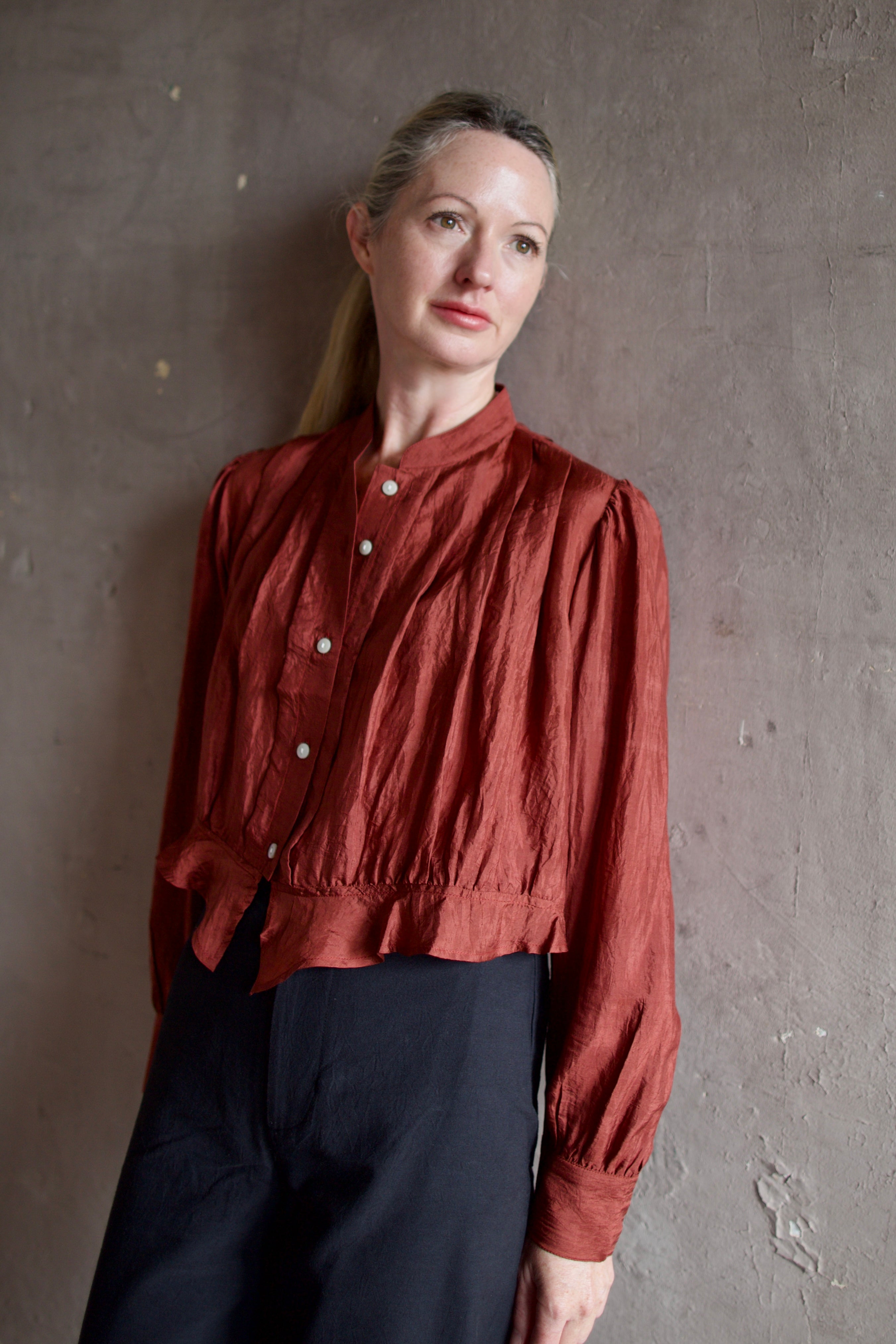 Model wearing Alix of Bohemia Ryland Saddle Shirt. Blouse has classic Edwardian design with premium silk construction and expert pleating techniques.