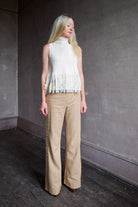 woman wearing beige 100% raw silk Alix of Bohemia tailored trouser no pockets clean back and front straight leg