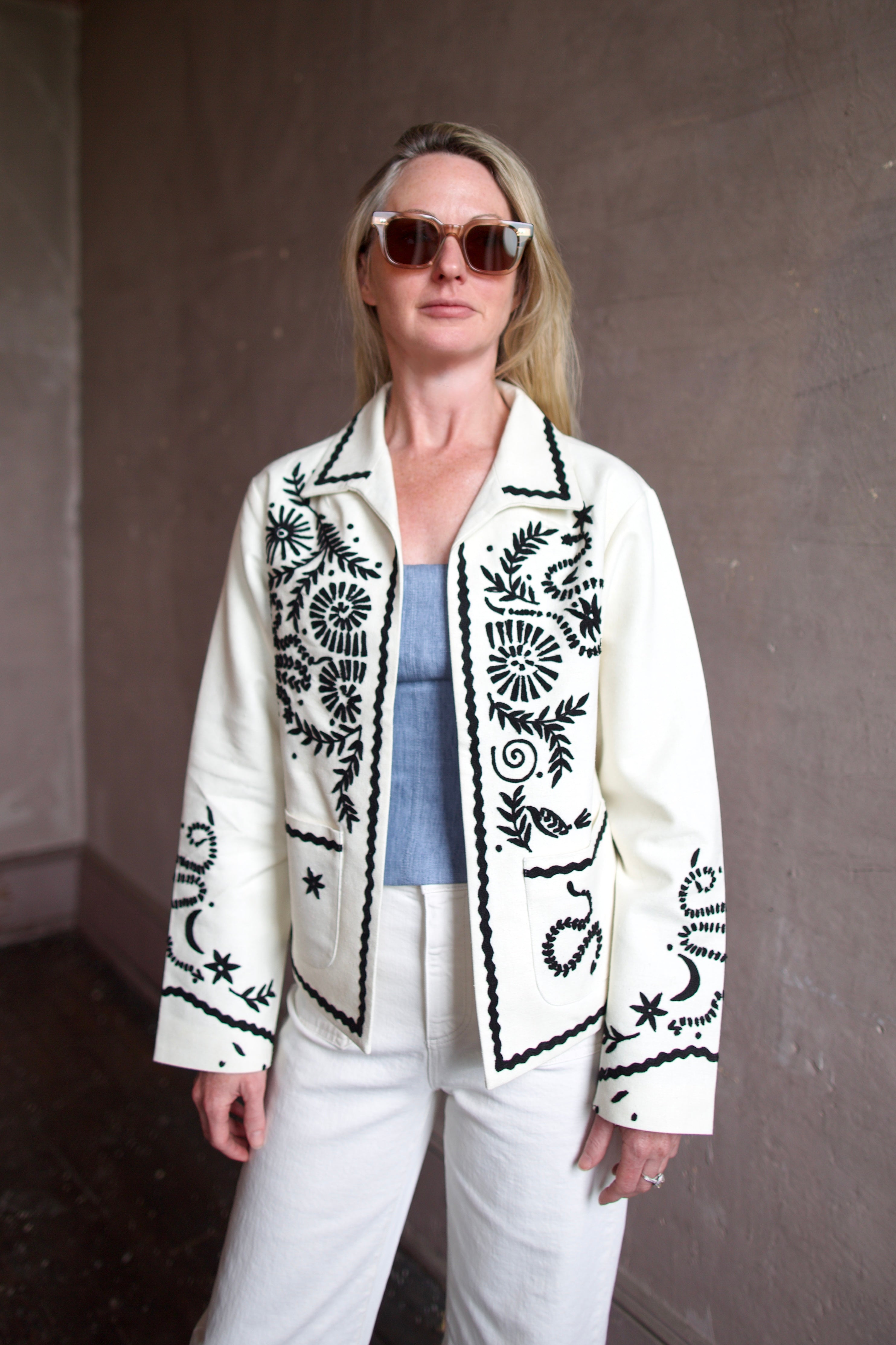 Mature woman wearing the Alix of Bohemia Francis Bone Snake Jacket in black and white colorway with luxury 100% silk fabric and Bohemian refinement