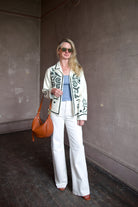 Mature woman wearing the Alix of Bohemia Francis Bone Snake Jacket in black and white colorway with luxury 100% silk fabric and Bohemian 