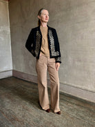 Image of woman wearing Alix of Bohemia premium wool  Pippa Spur button down open as a luxury layering shacket for elevated style