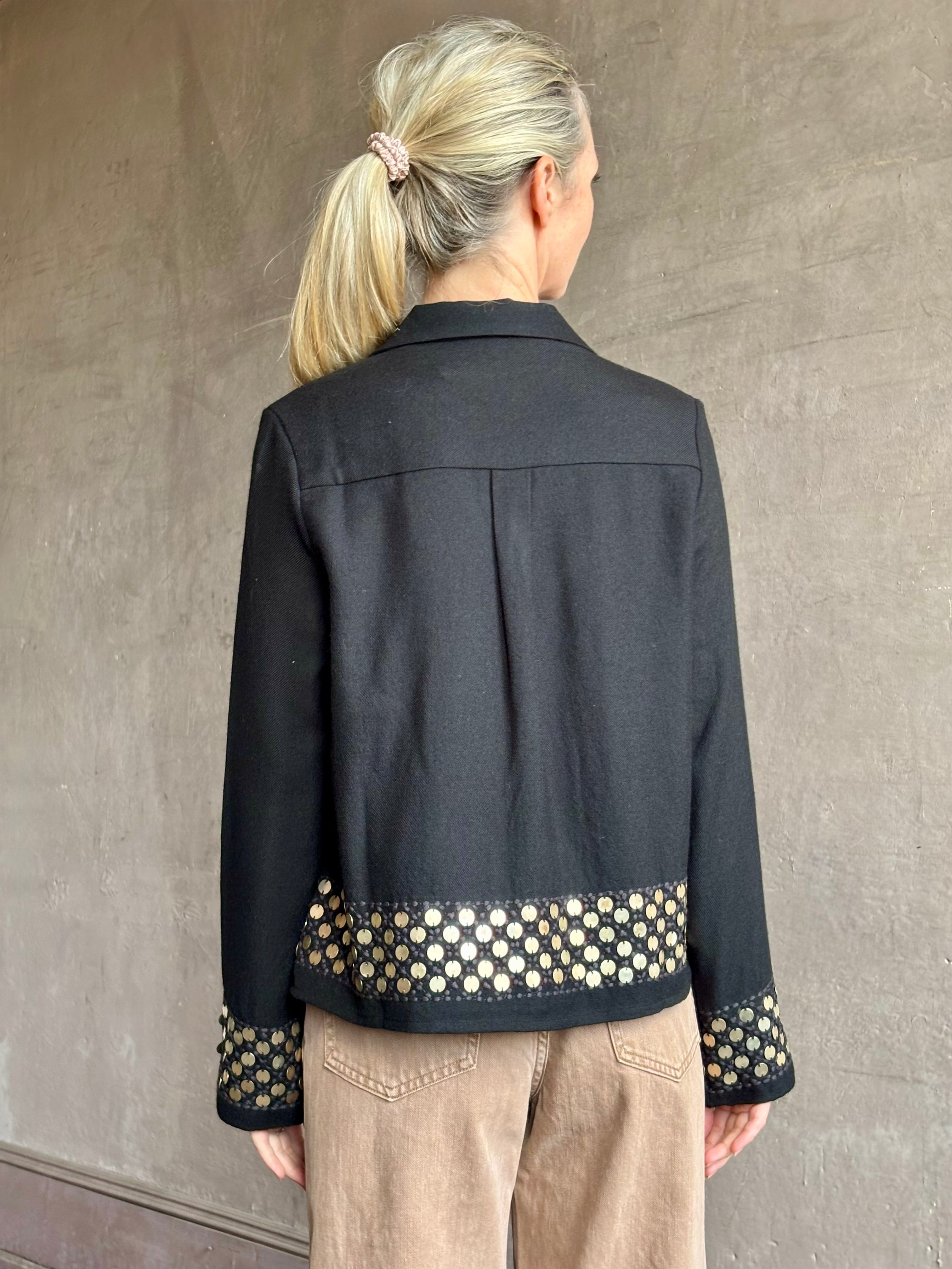 Image of woman wearing Alix of Bohemia premium wool  Pippa Spur button down black Shirt with brass coin embellishments long sleeves and collar