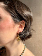 Woman wearing Large Succulent Drop Earrings from North Carolina fine jewelry artist Amber Mahler exquisitely handcrafted 18K yellow gold vermeil botanical casting