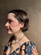 Woman wearing Large Succulent Drop Earrings from North Carolina fine jewelry artist Amber Mahler exquisitely handcrafted 18K yellow gold vermeil botanical casting
