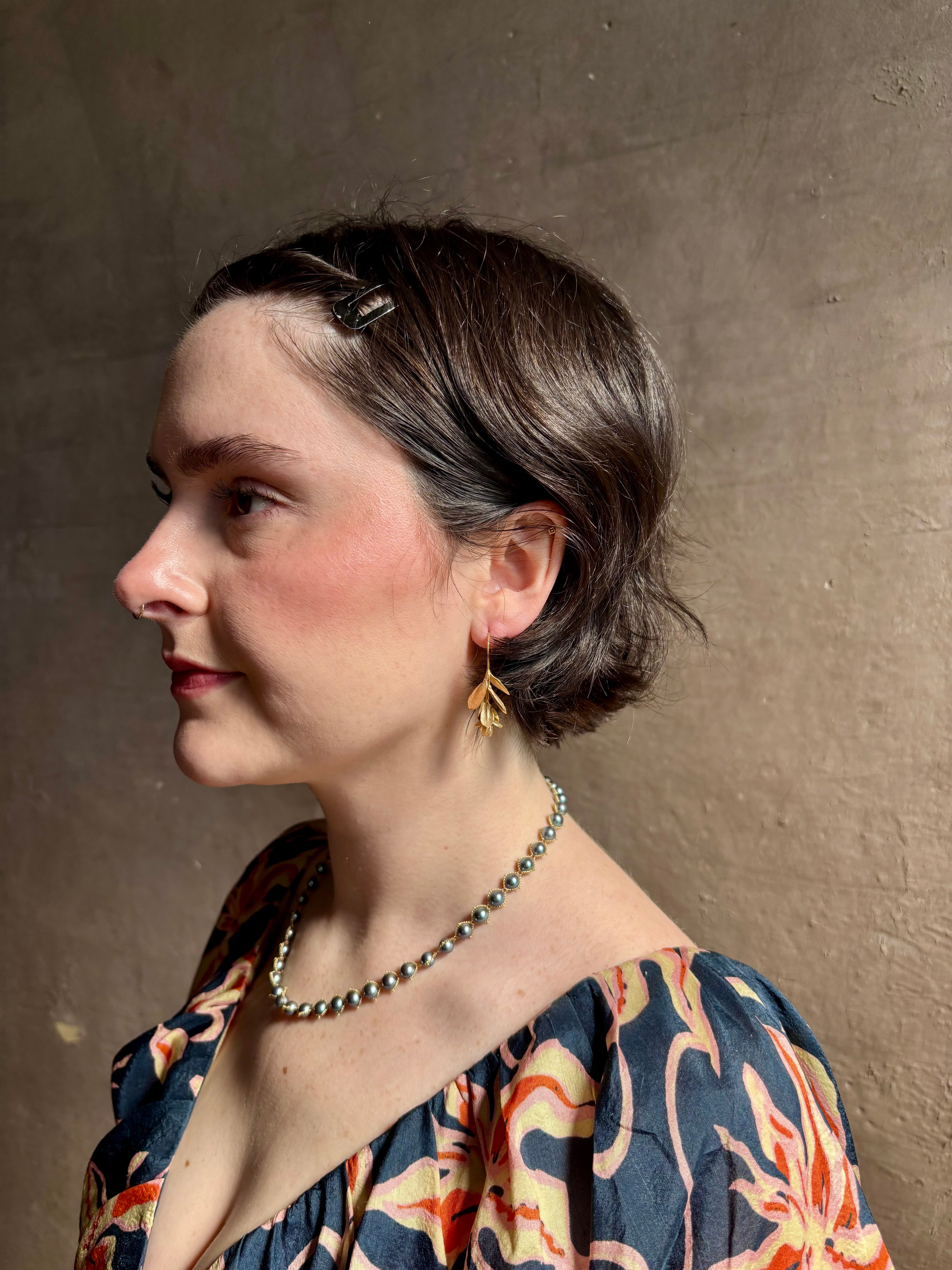 Woman wearing Large Succulent Drop Earrings from North Carolina fine jewelry artist Amber Mahler exquisitely handcrafted 18K yellow gold vermeil botanical casting