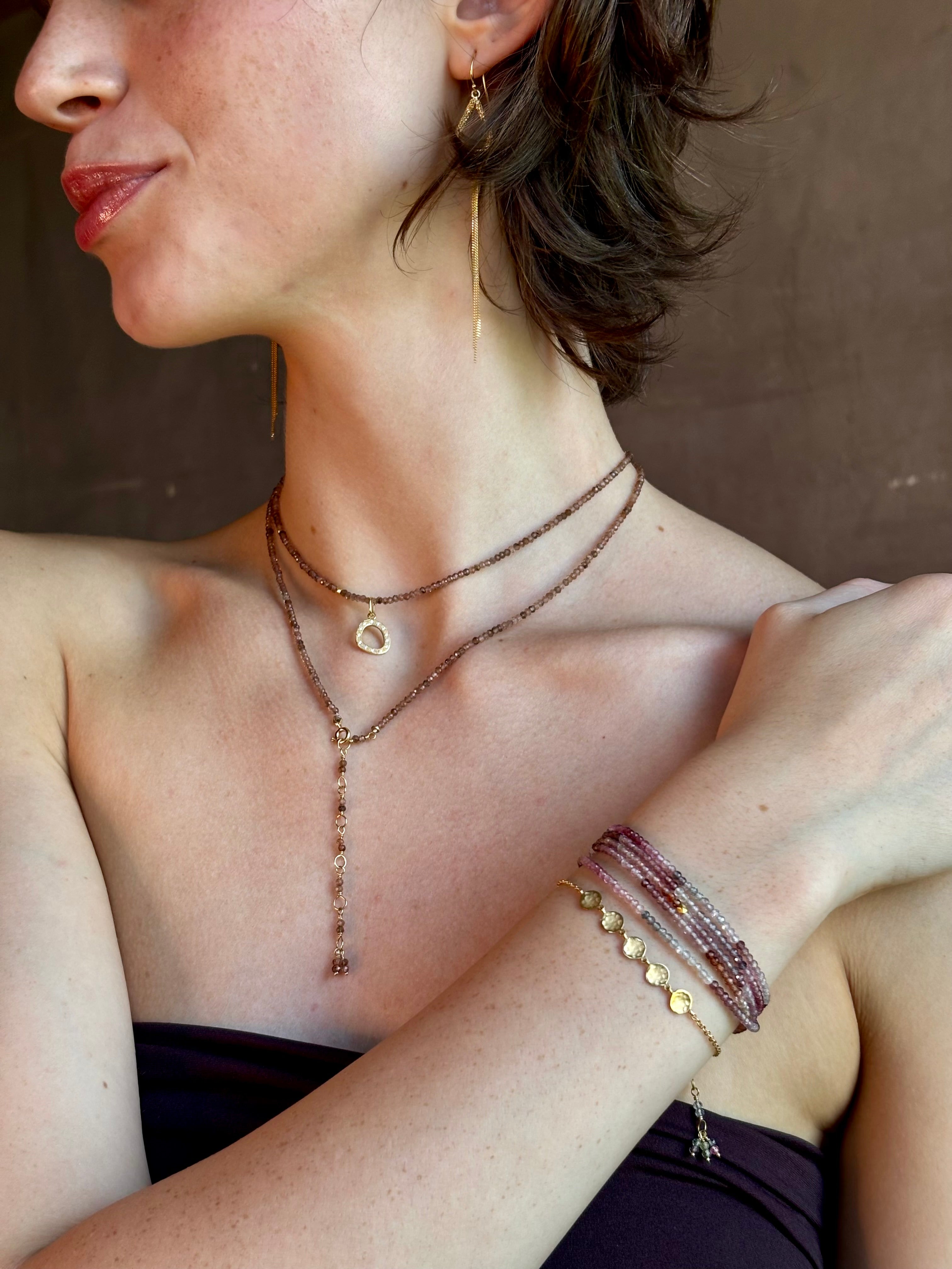 delicate 18K yellow gold bracelet by fine jewelry artist Anne Sportun handcrafted with 5 hammered gold discs