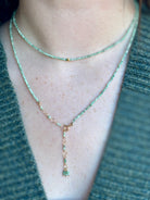 Image of woman wearing Canadian fine jewelry designer ANNE SPORTUN Emerald Wrap Bracelet in 18K Yellow Gold can also be worn as a necklace