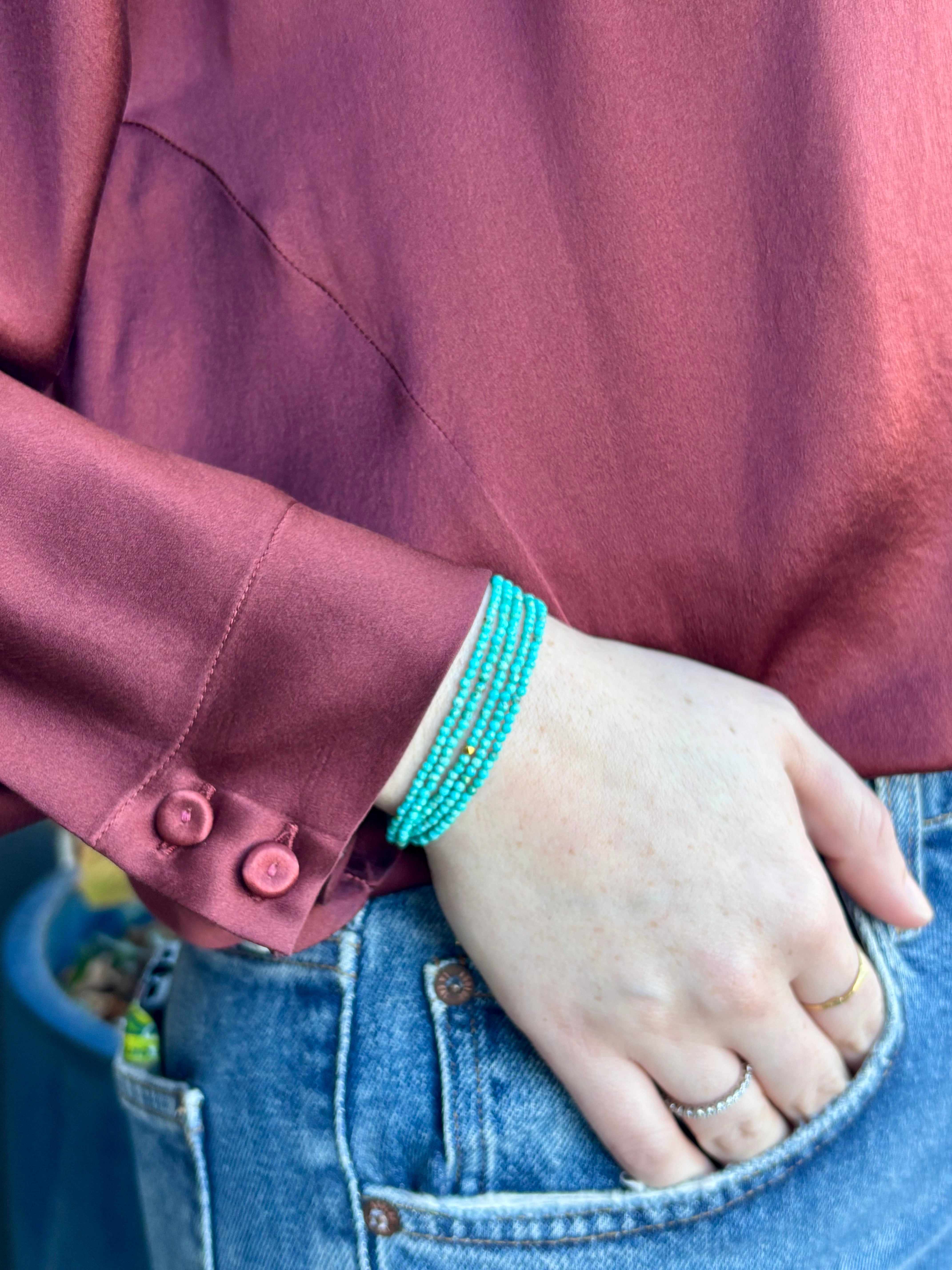 Image of woman wearing Canadian Jewelry designer ANNE SPORTUN Turquoise Wrap Bracelet in 18K Yellow Gold